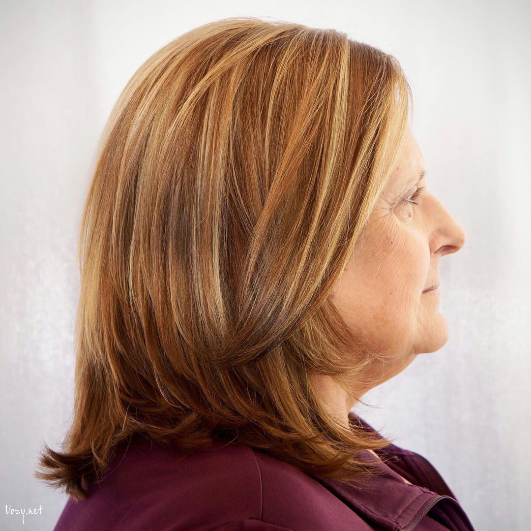 long layered hairstyle for women in their 50s with round face