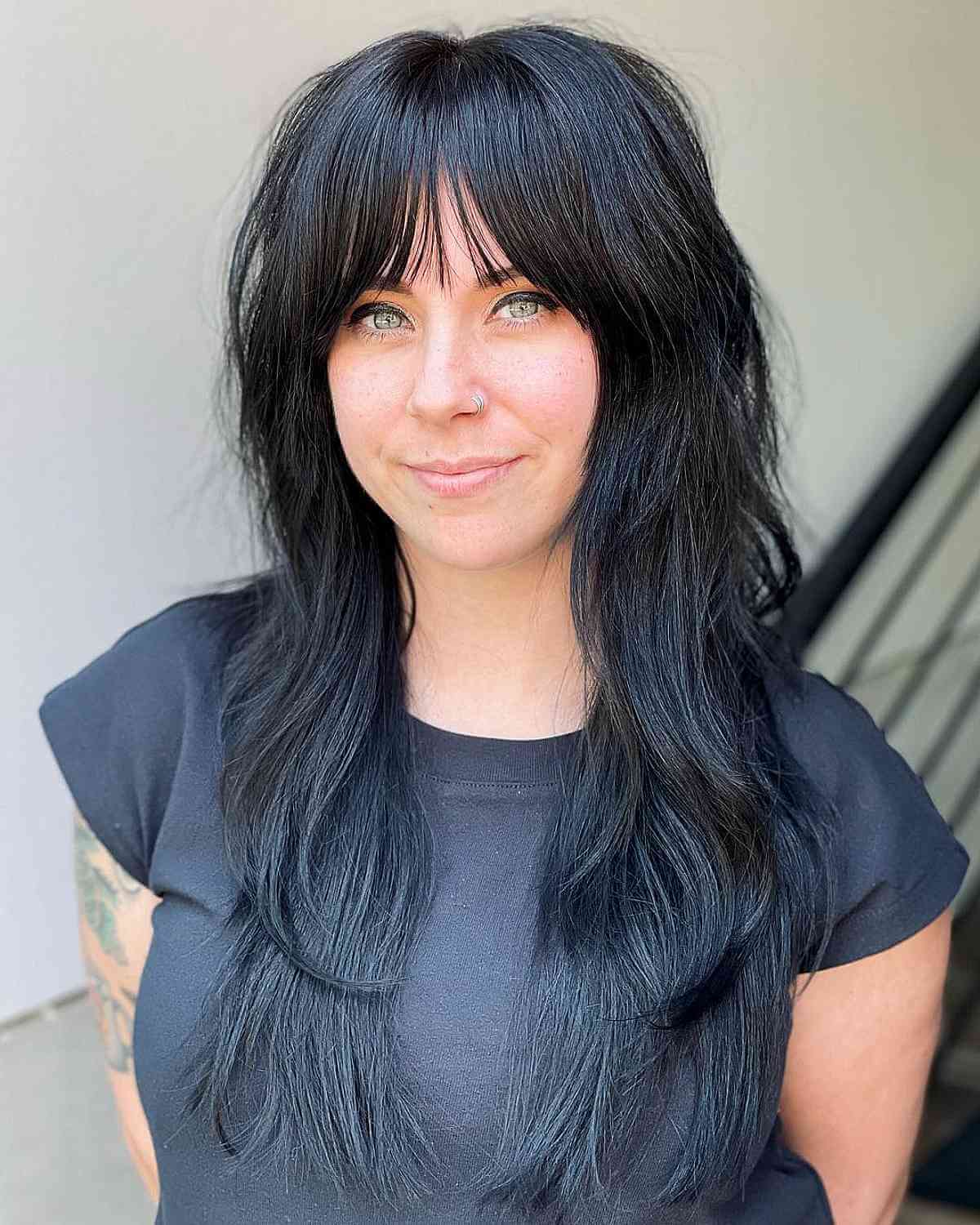 long length razored shag with light bangs for a wash and wear style