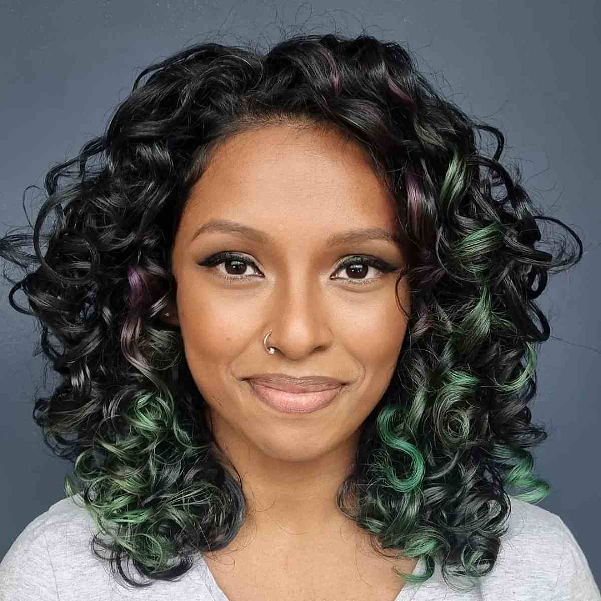 medium length bright purple and jade curls