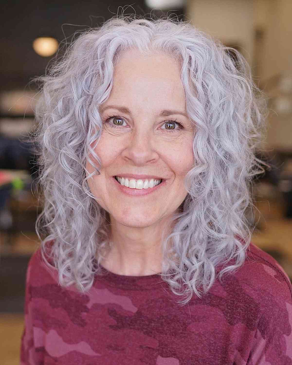 medium length gorgeous gray curls with a middle part