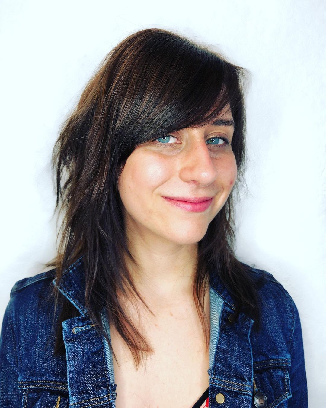 medium length hair with side swept bangs for oval face