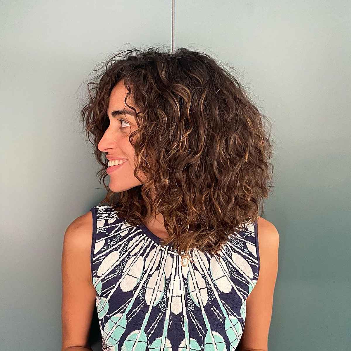 medium length layered curly cut for women