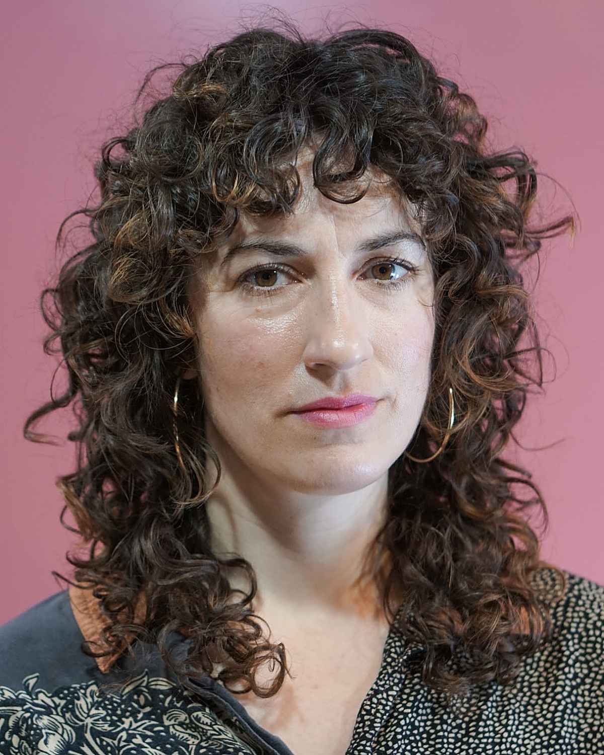 mid length curly shag cut with curly bangs