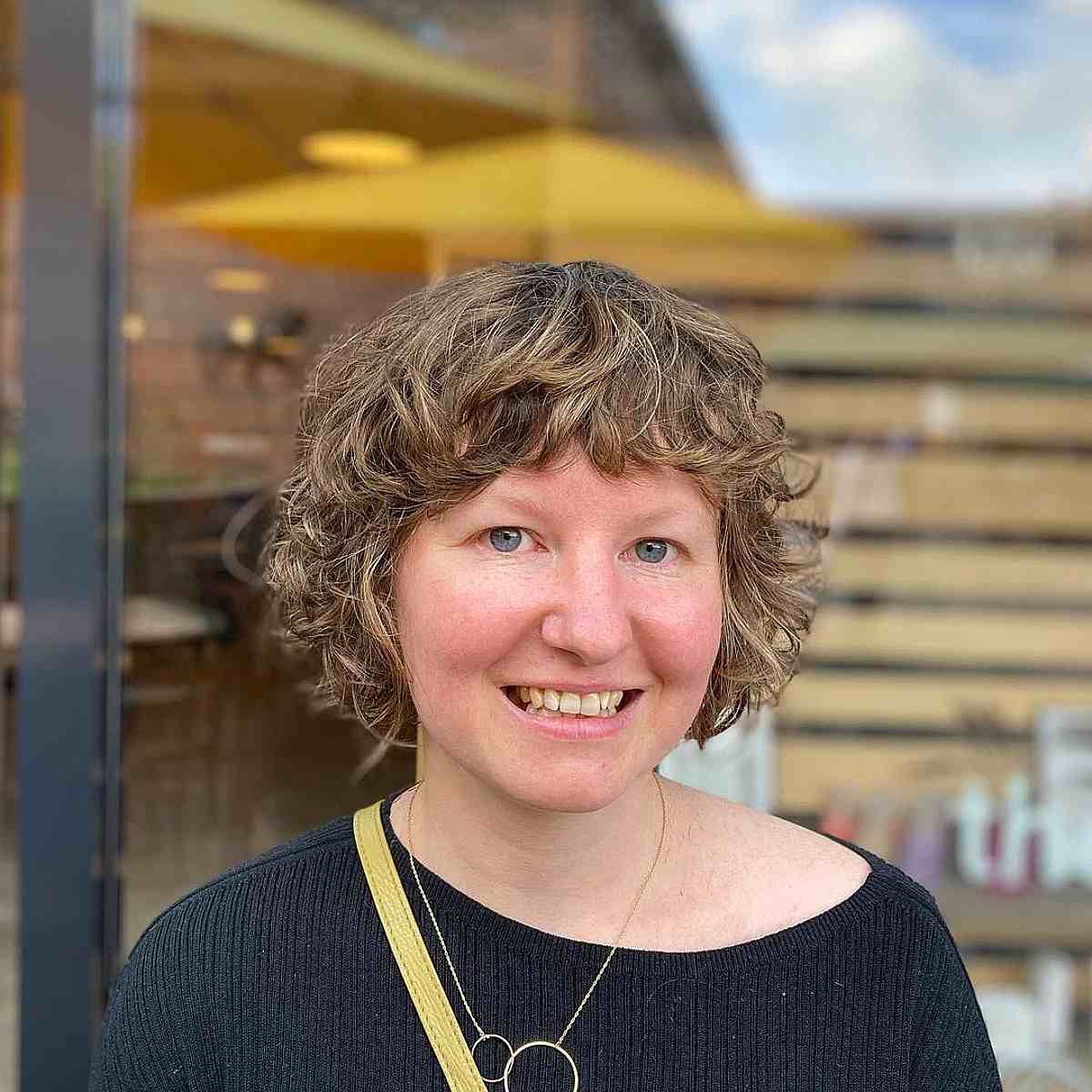 mini chin length curly shag with short bangs