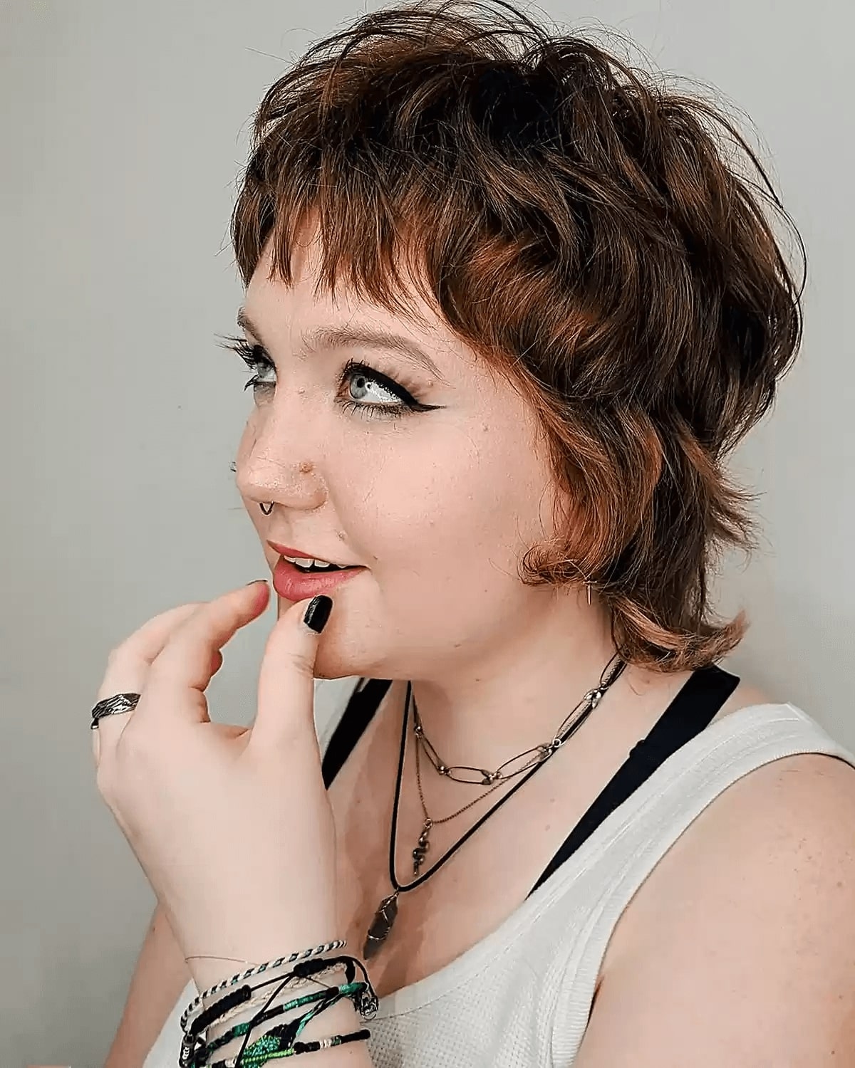 mini wolf cut mullet with short layers and bangs