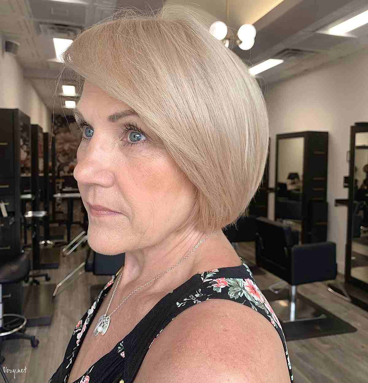 modern round bob with long side bangs for fifty year old women