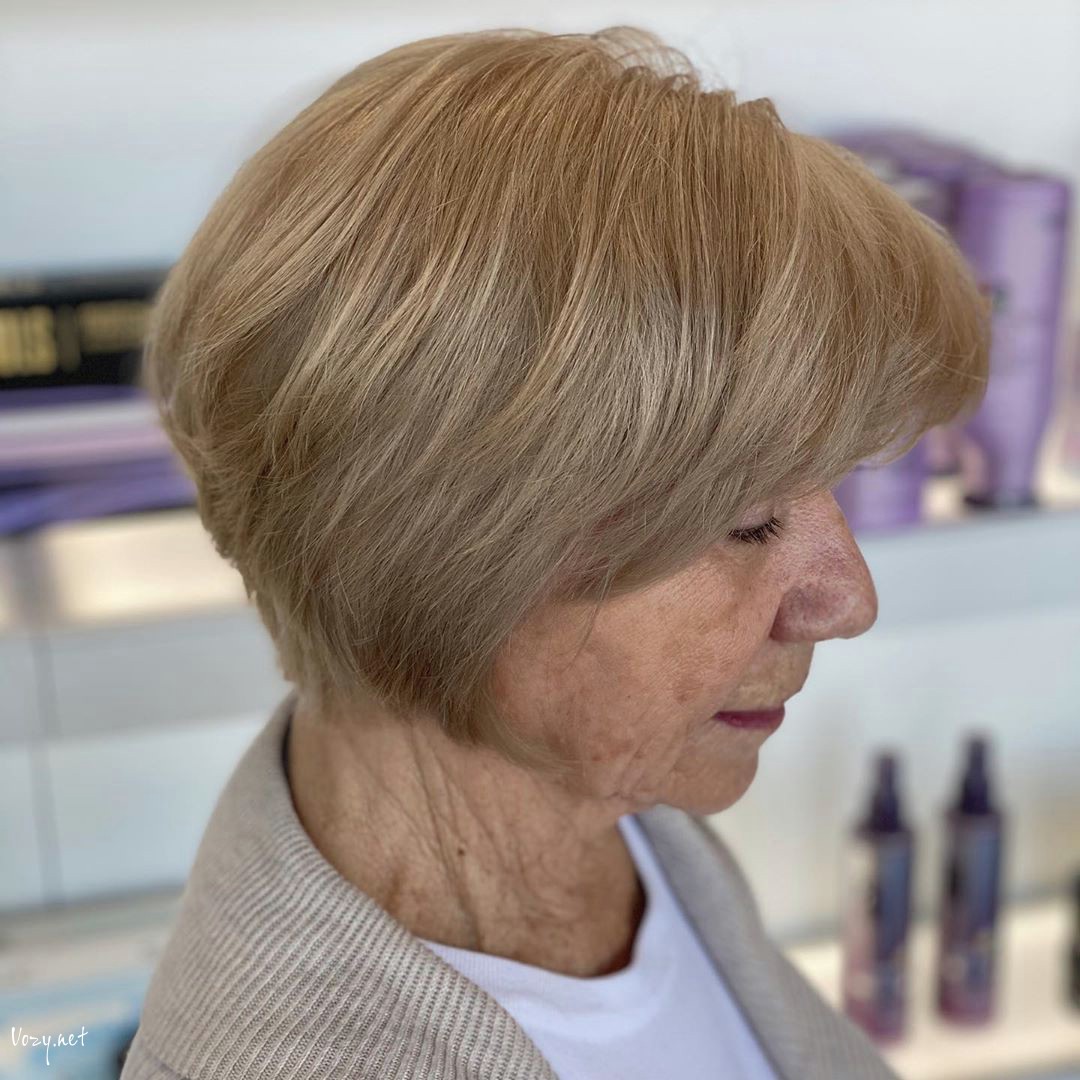 modern wedge bob with bangs for ladies over 50