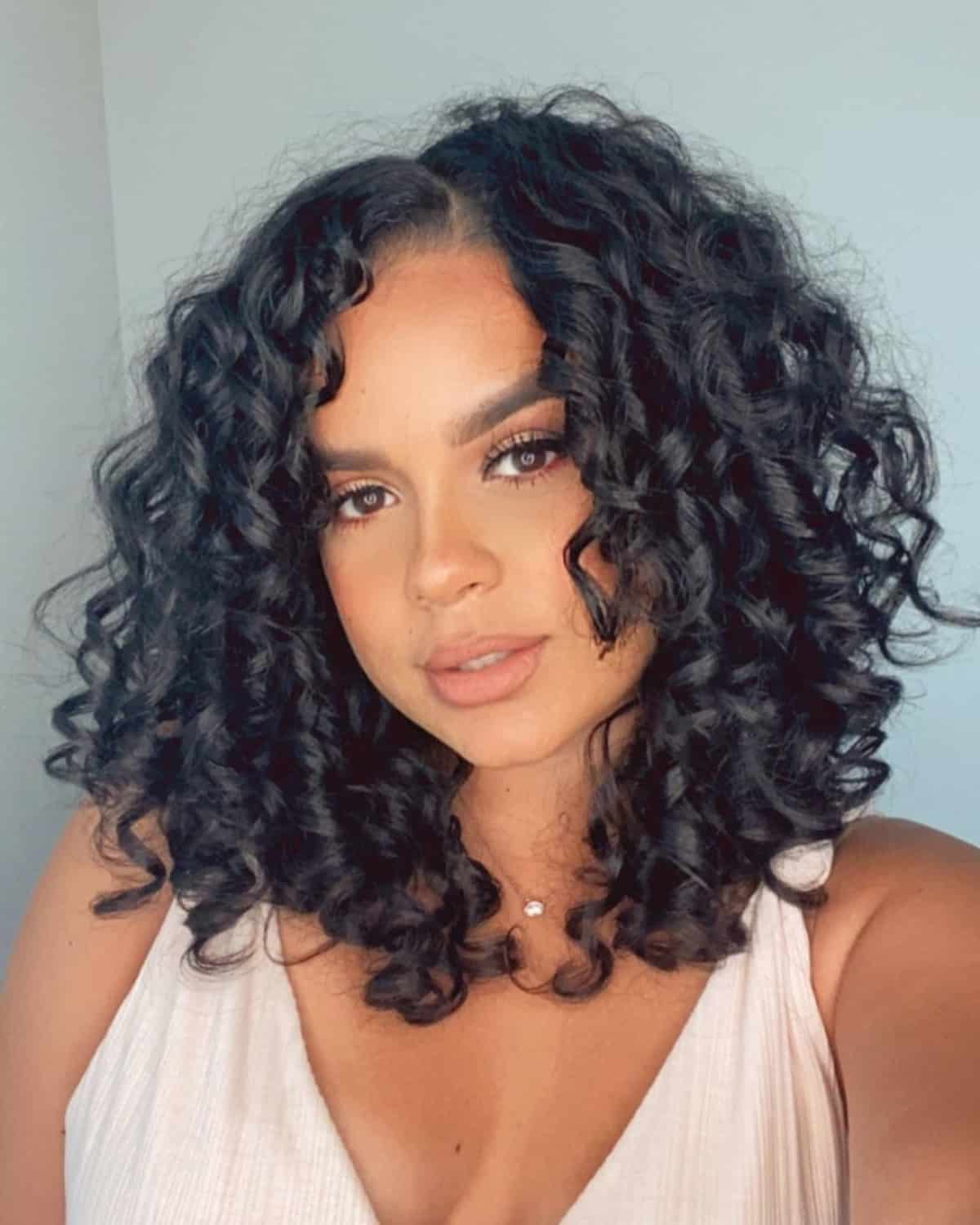 naturally curly mid length cut for a round face