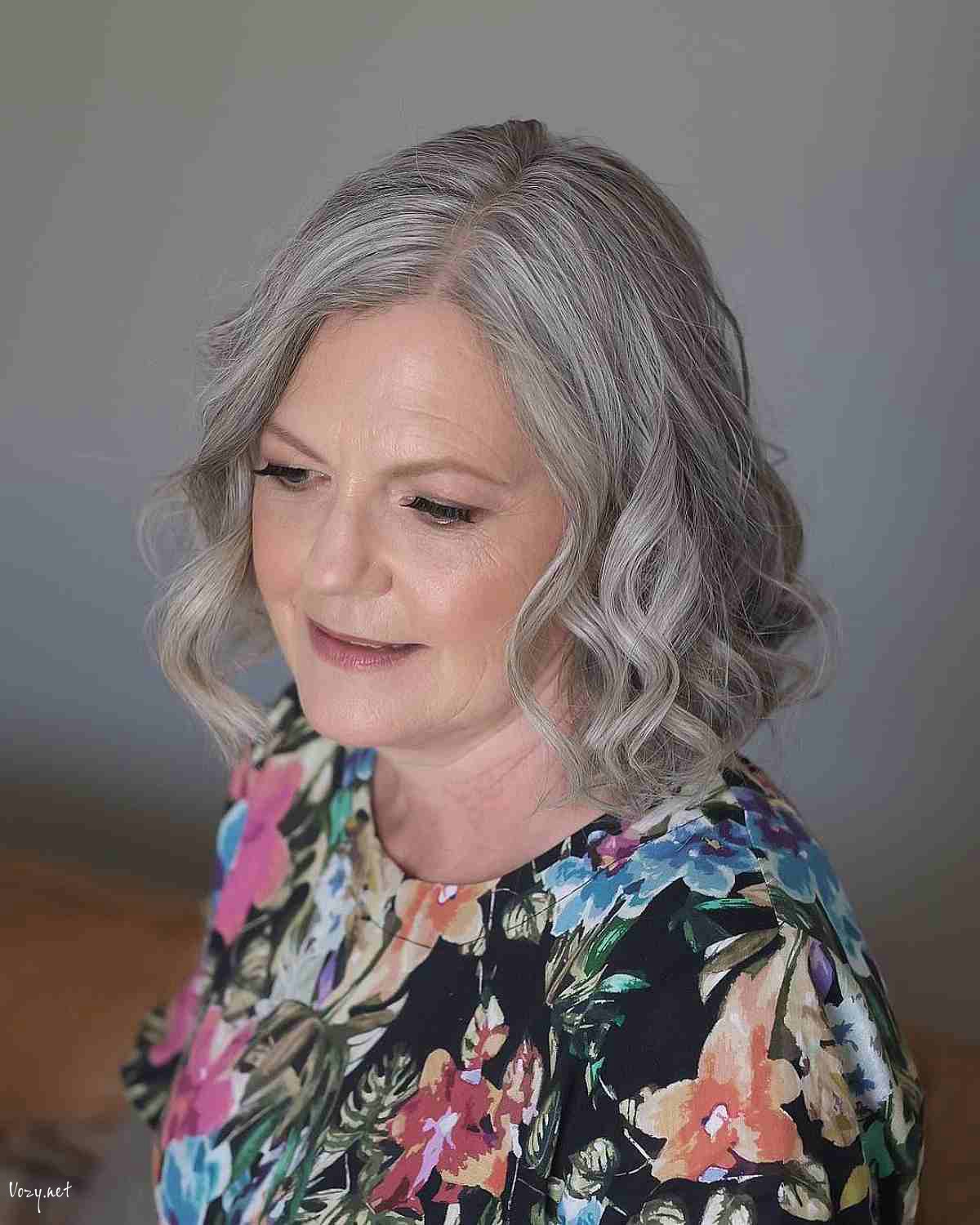 neck length cut with soft curls for a 50 year old lady