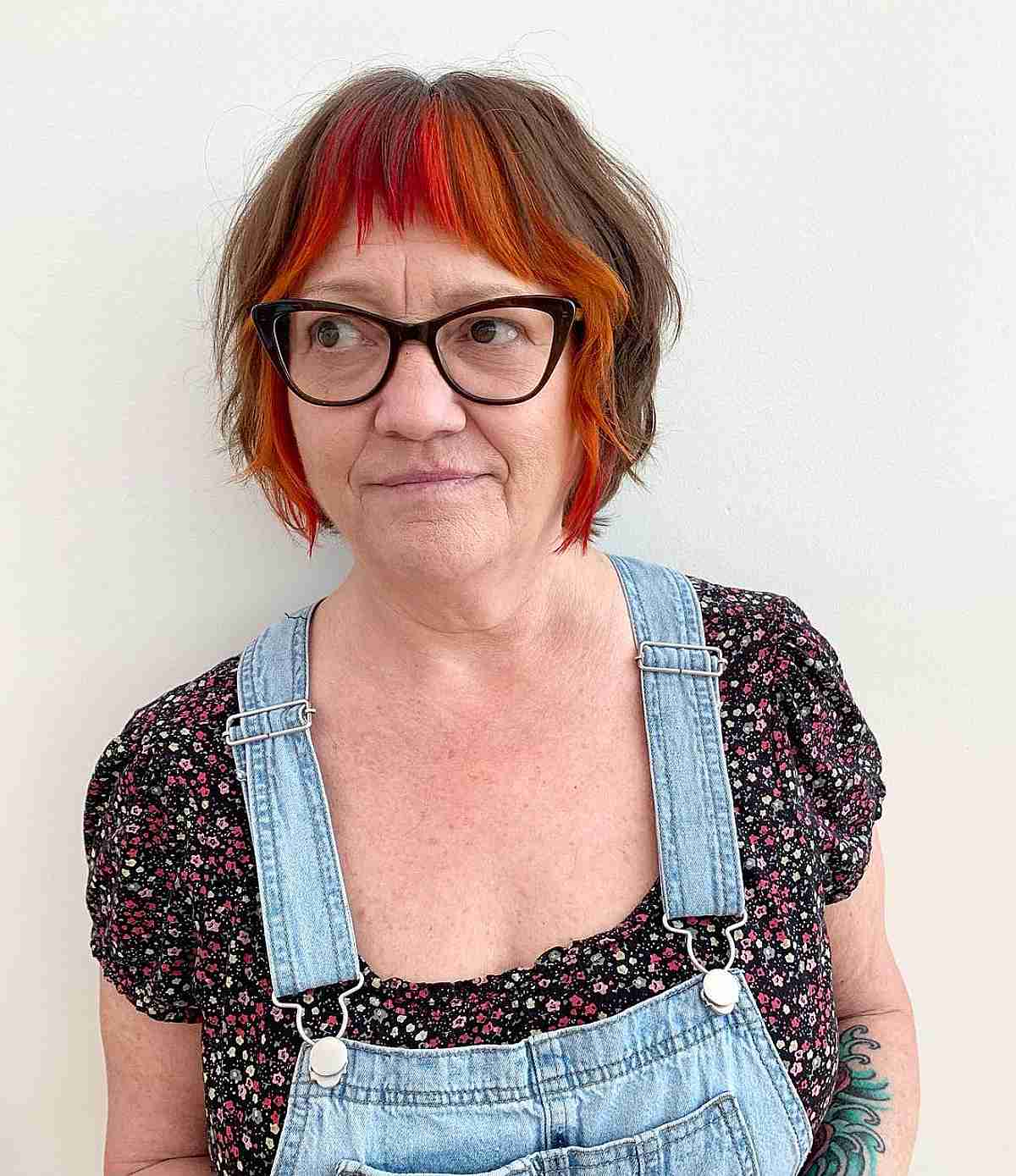 shaggy bob with red orange money piece for women 50 and over
