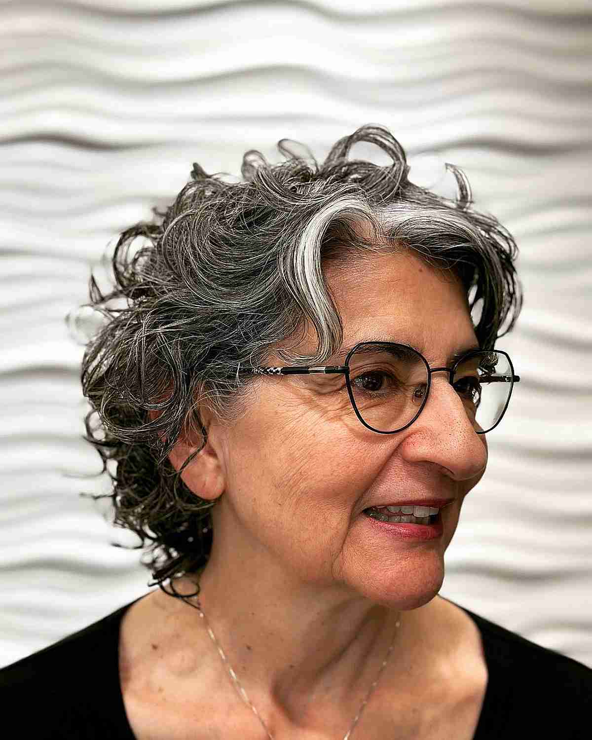 shaggy curly bixie hair for older women over 70 with glasses