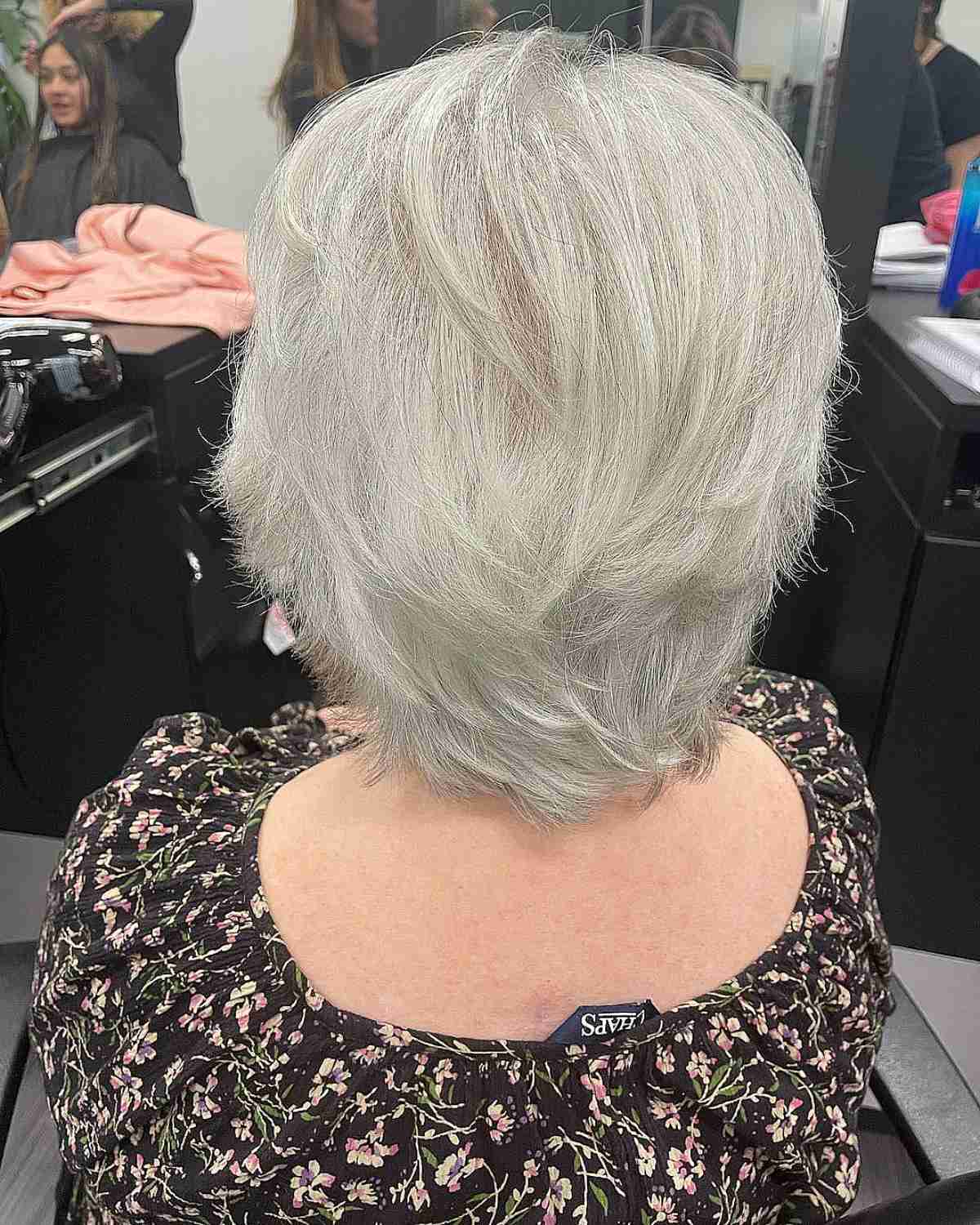 shaggy grey pixie hair with feathery layers for ladies over seventy