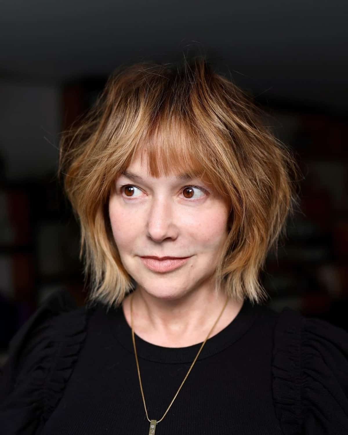 shaggy long bob with curtain bangs for women over 50