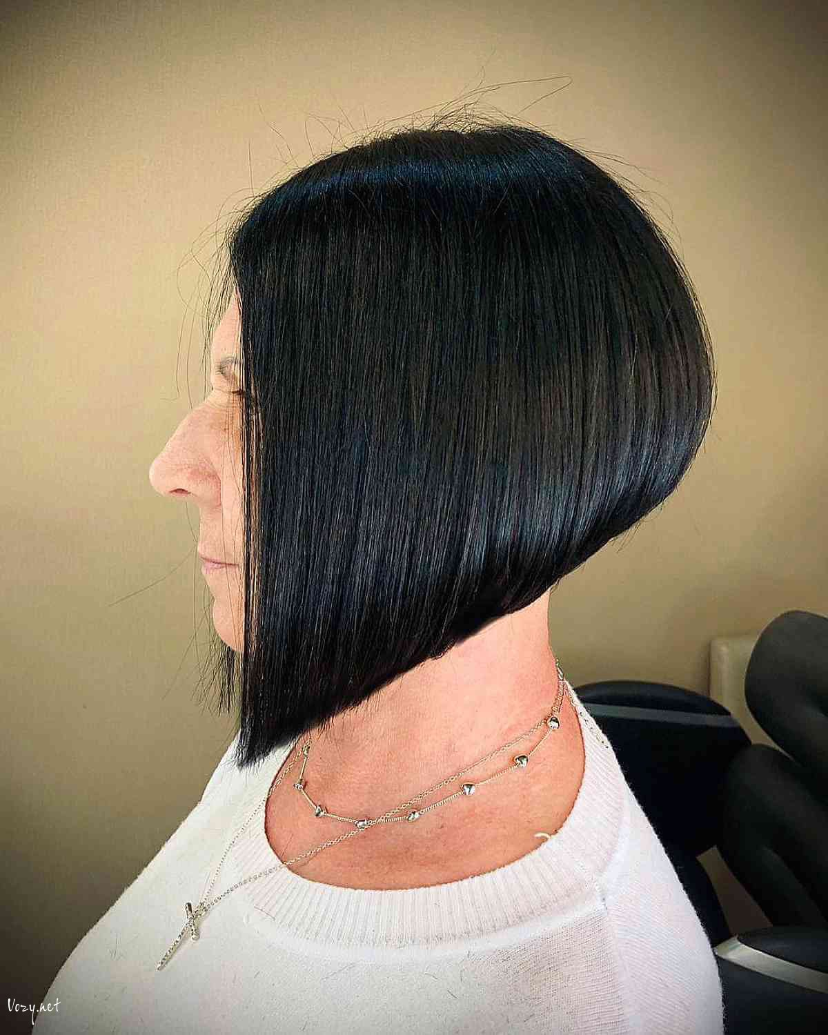 sharply angled jet black bob for thick haired 50 year olds