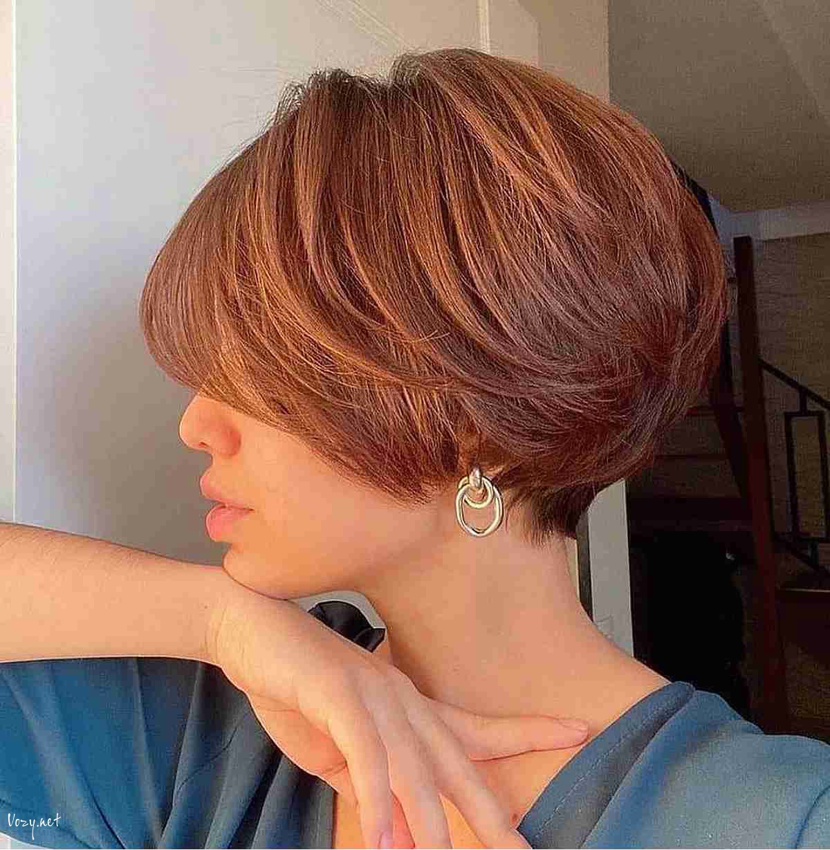 short auburn bixie with long layers