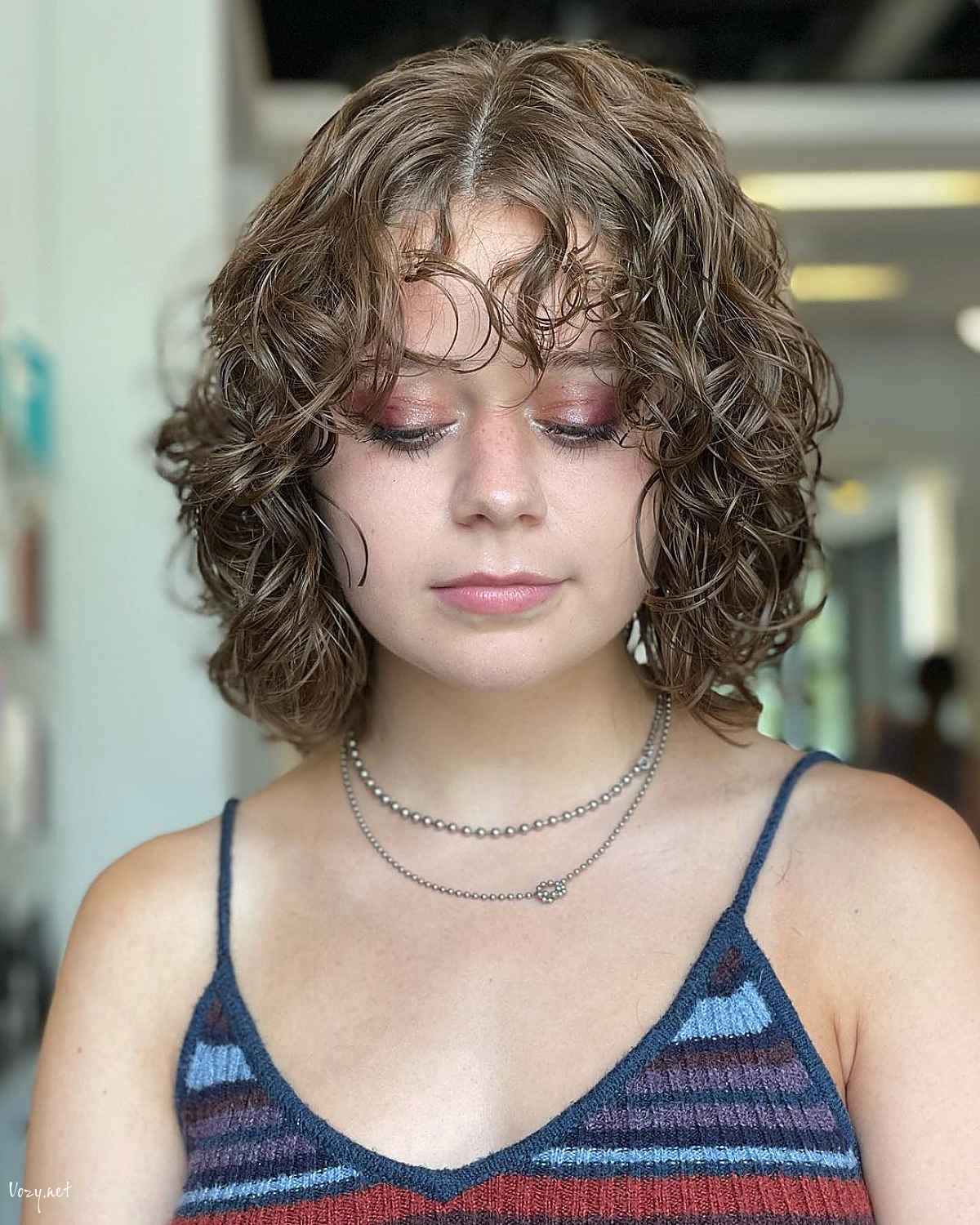 short bob for women with curly hair and round face shapes