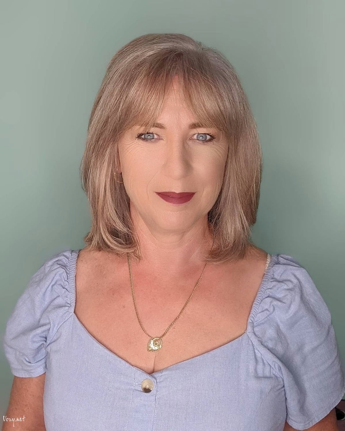 short bob with curtain bangs for women over 50