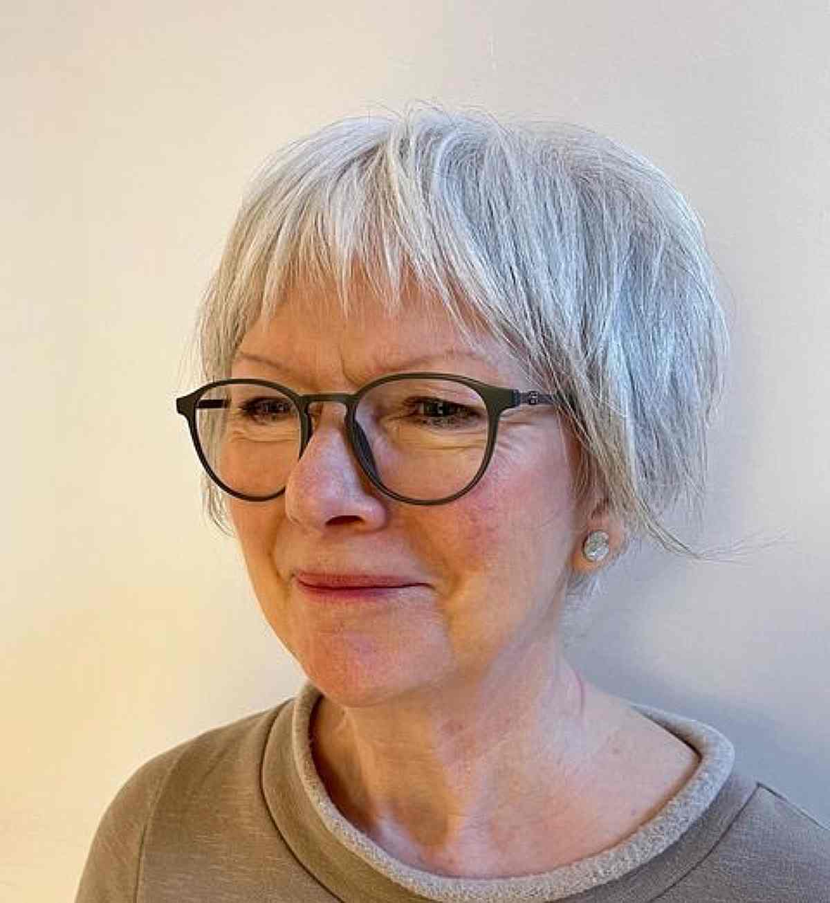 short shaggy bixie with micro choppy bangs for women in their 50s