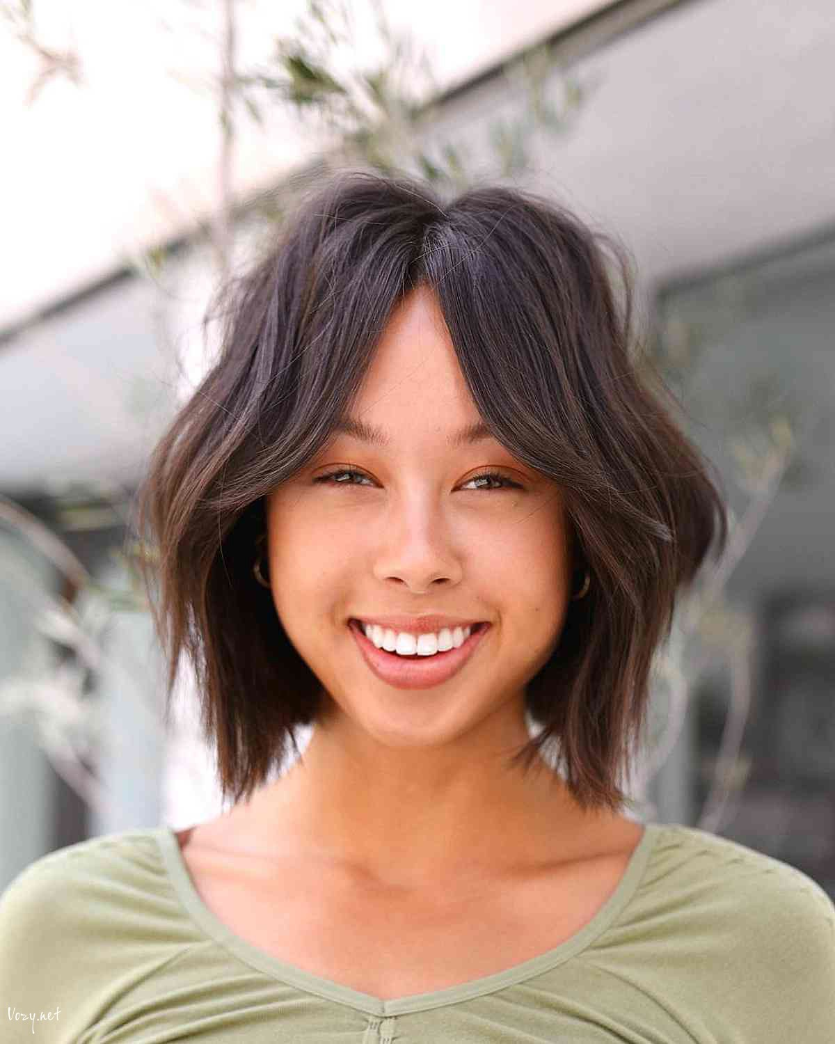 short shaggy bob with a middle part hairstyle