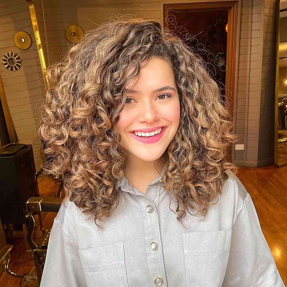 shoulder length curly locks with side bangs