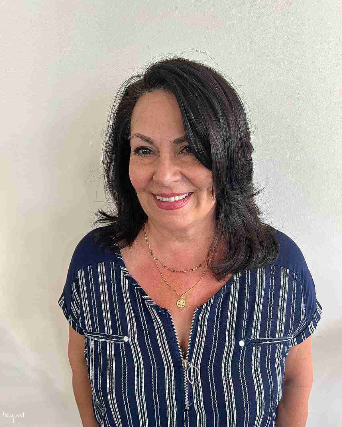 side pared medium layered hairstyle for women 50 and over