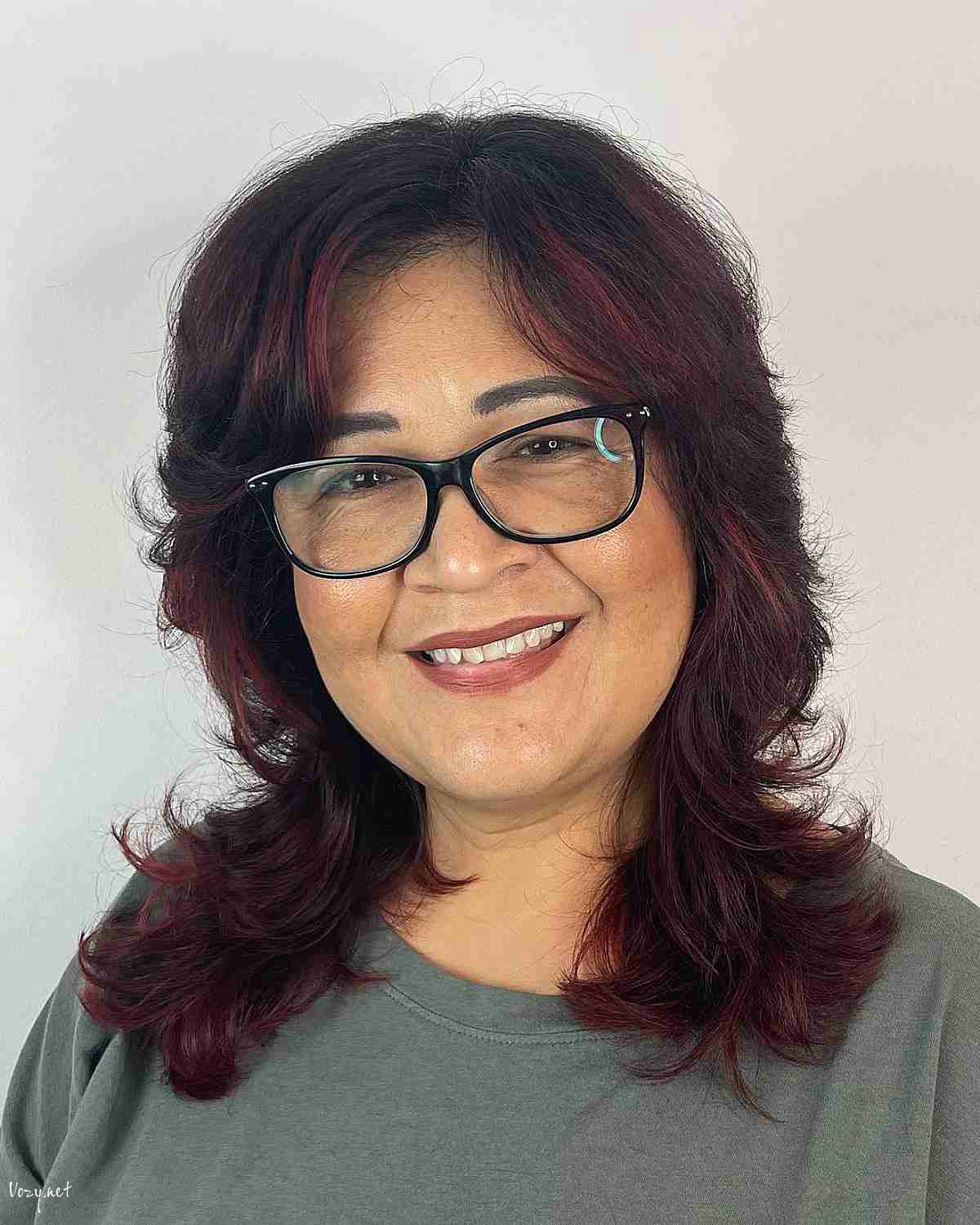 side part shaggy wolf mullet on dark hair with red lowlights