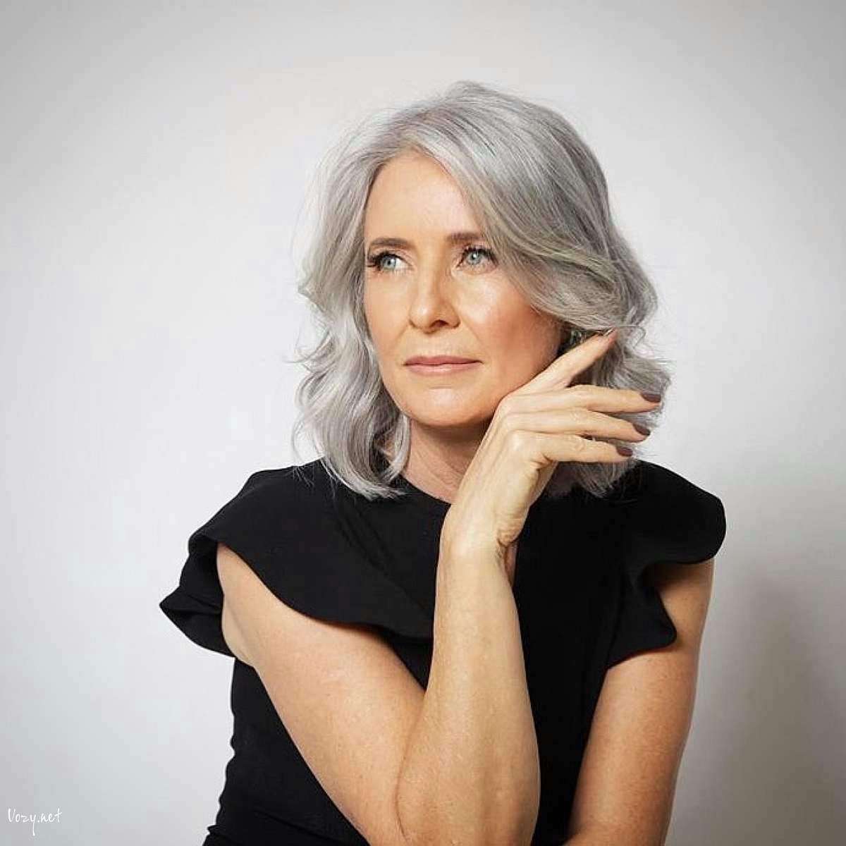 side part shoulder length hair with soft waves for women over fifty