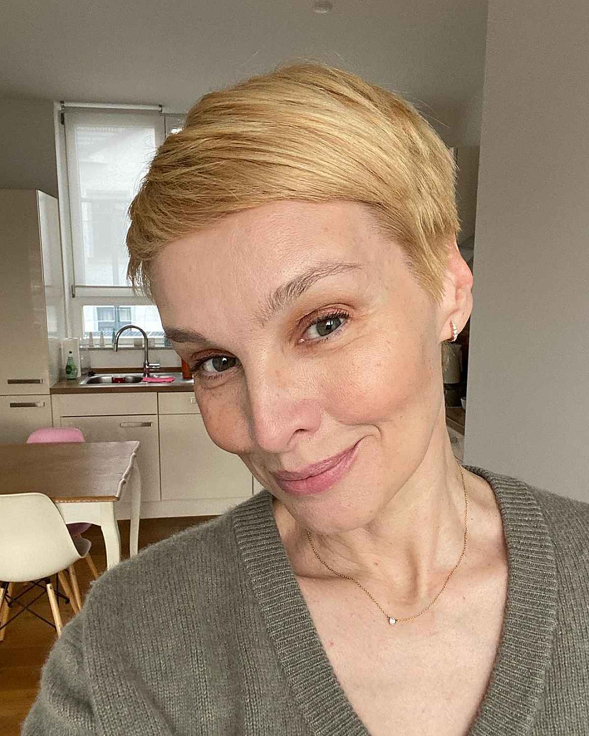 side swept pixie hairstyle for ladies over 50 with thin hair