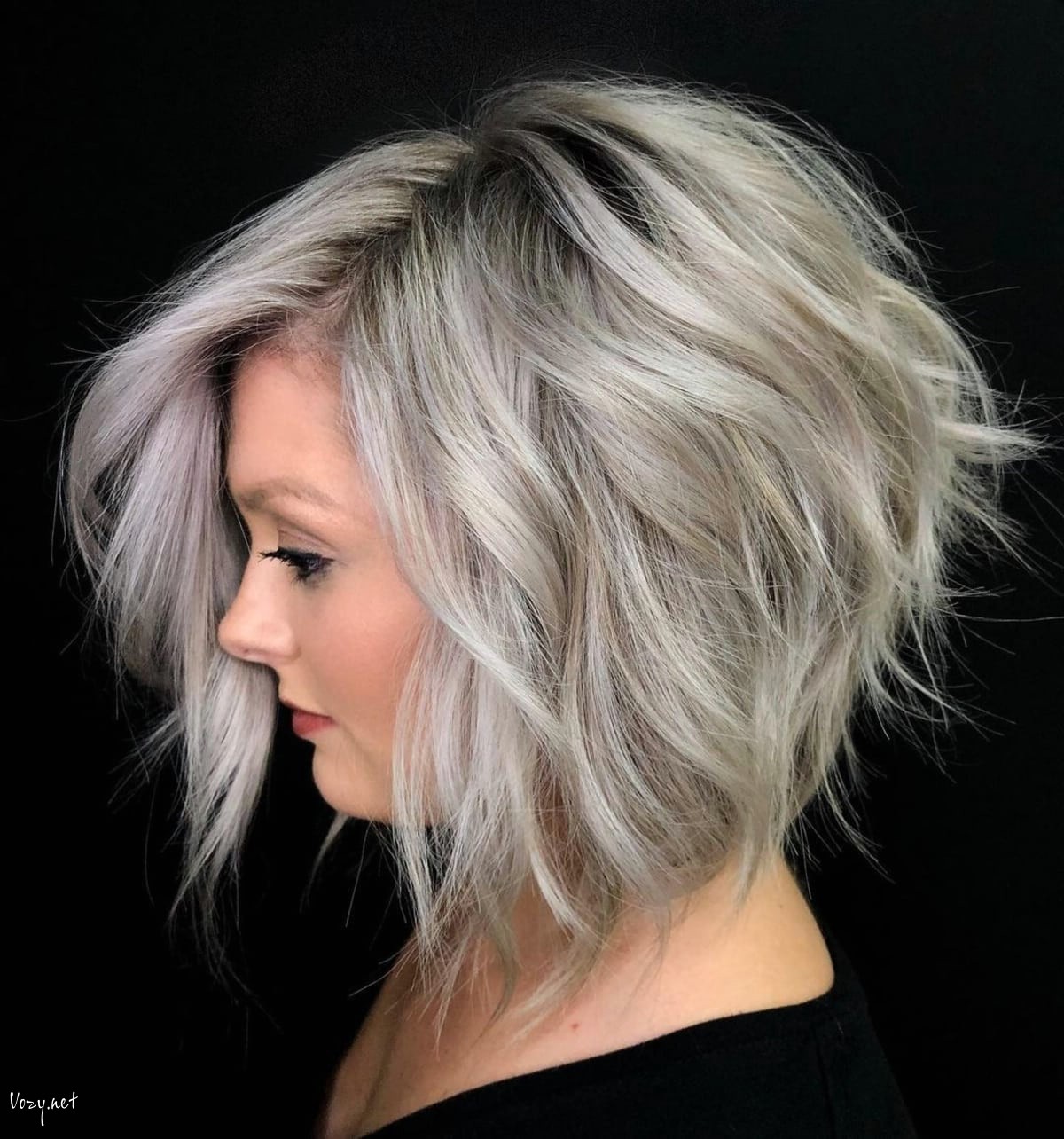 silver short bob shag hairstyle with a side part