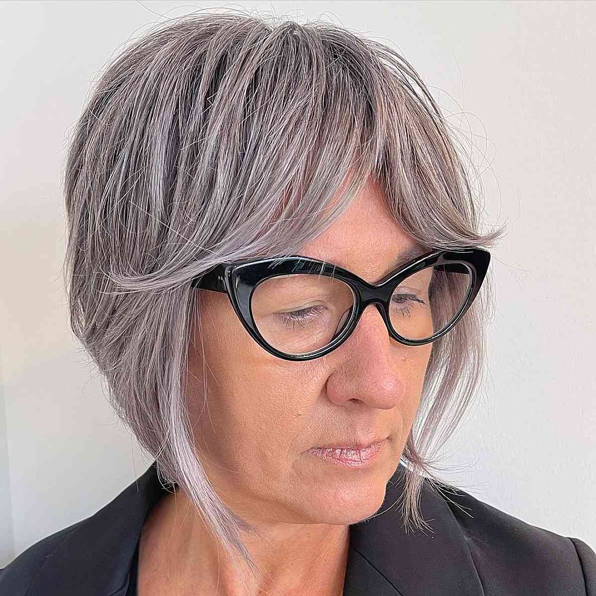 straight blonde bob for woman over 50 with glasses