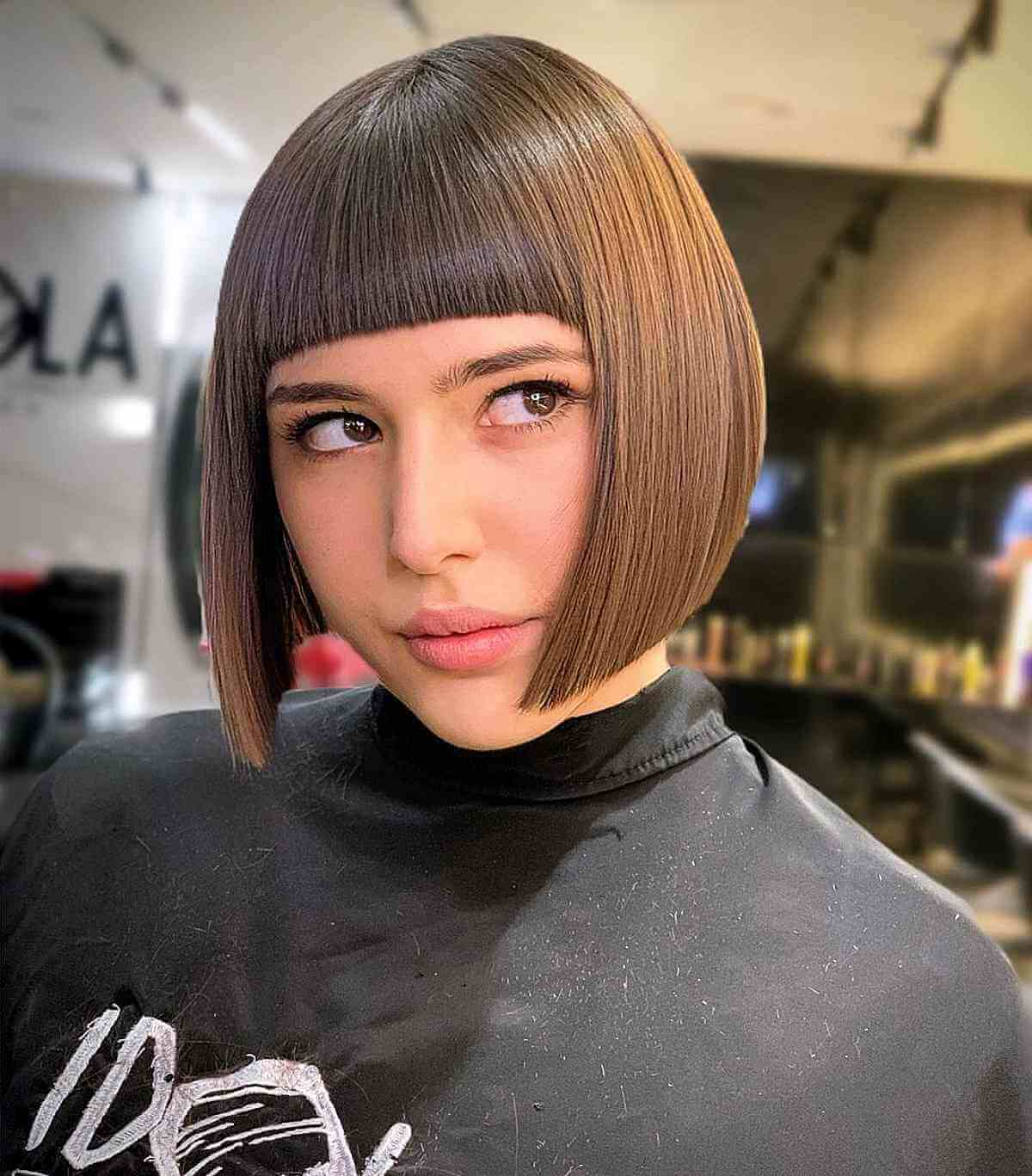 straight hair with blunt bangs for oval faces