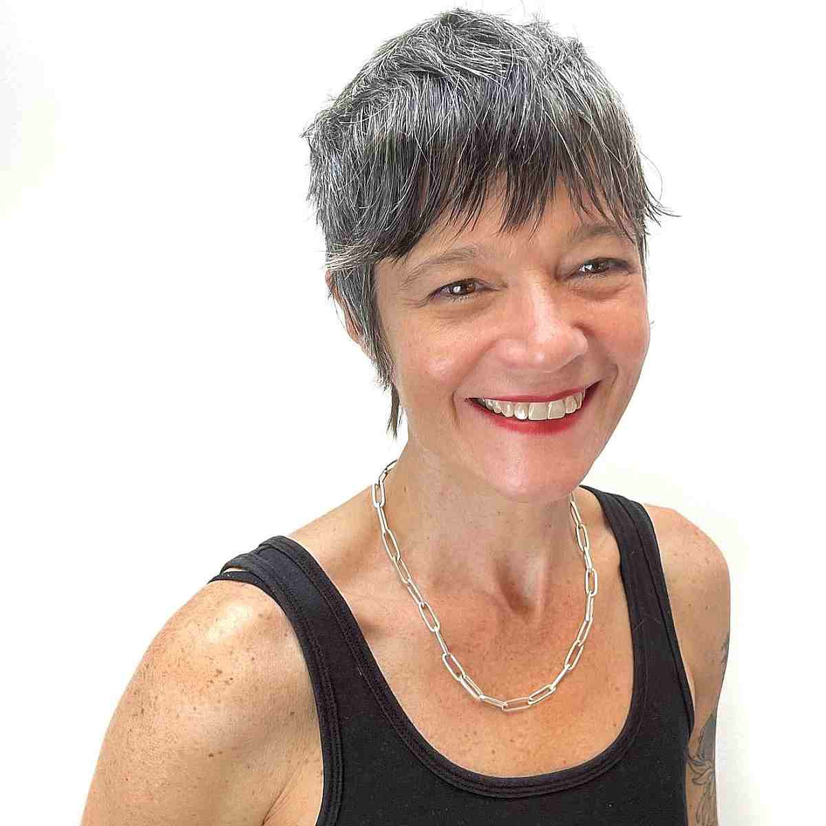 super short pixie with textured bangs for 50 year old ladies