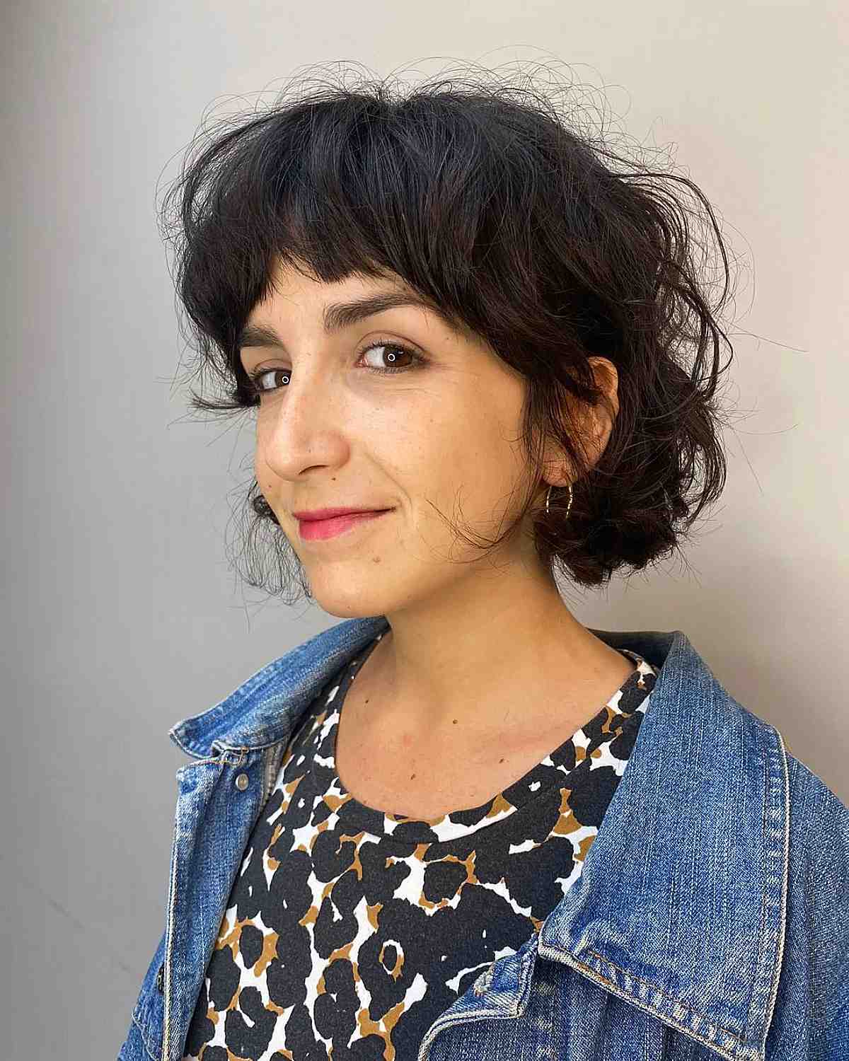 textured french curly bob with a fringe
