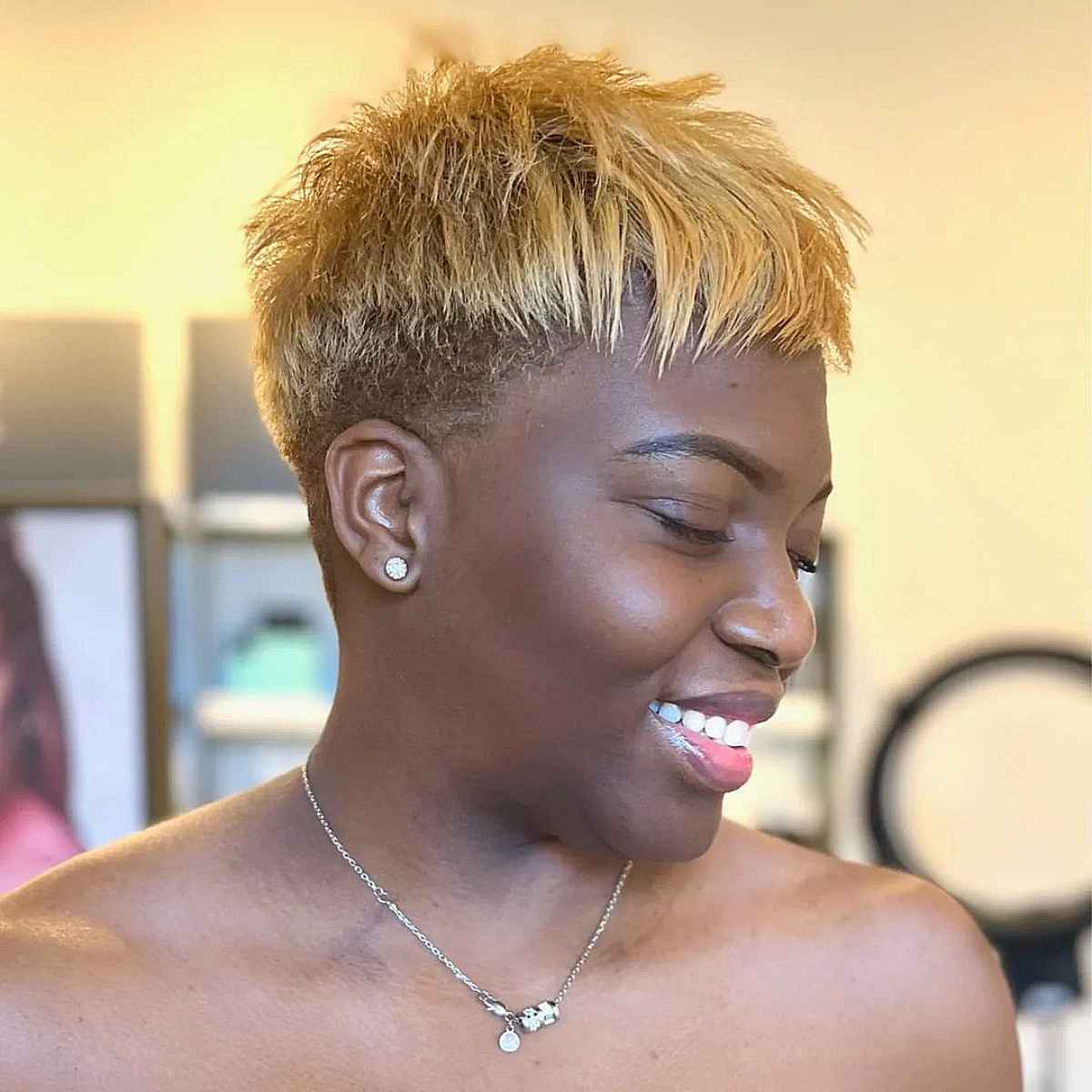 textured golden blonde pixie style with bangs for black women