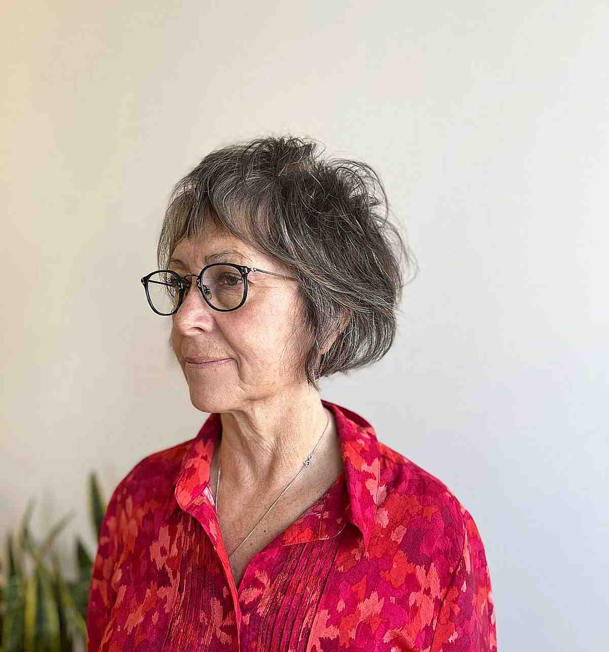 textured jaw length wispy bob with bangs for older women