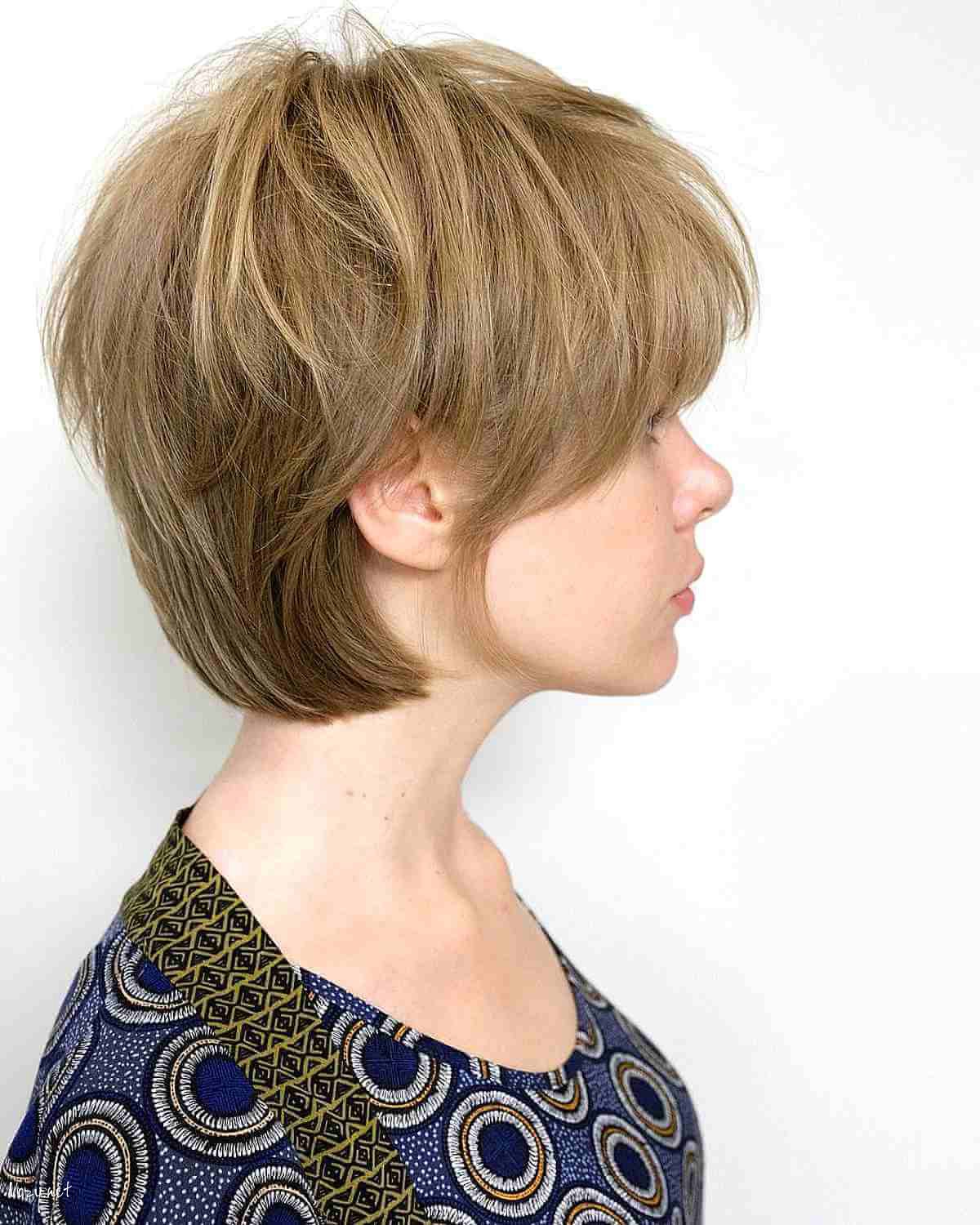 textured pixie bob with bangs and sideburns