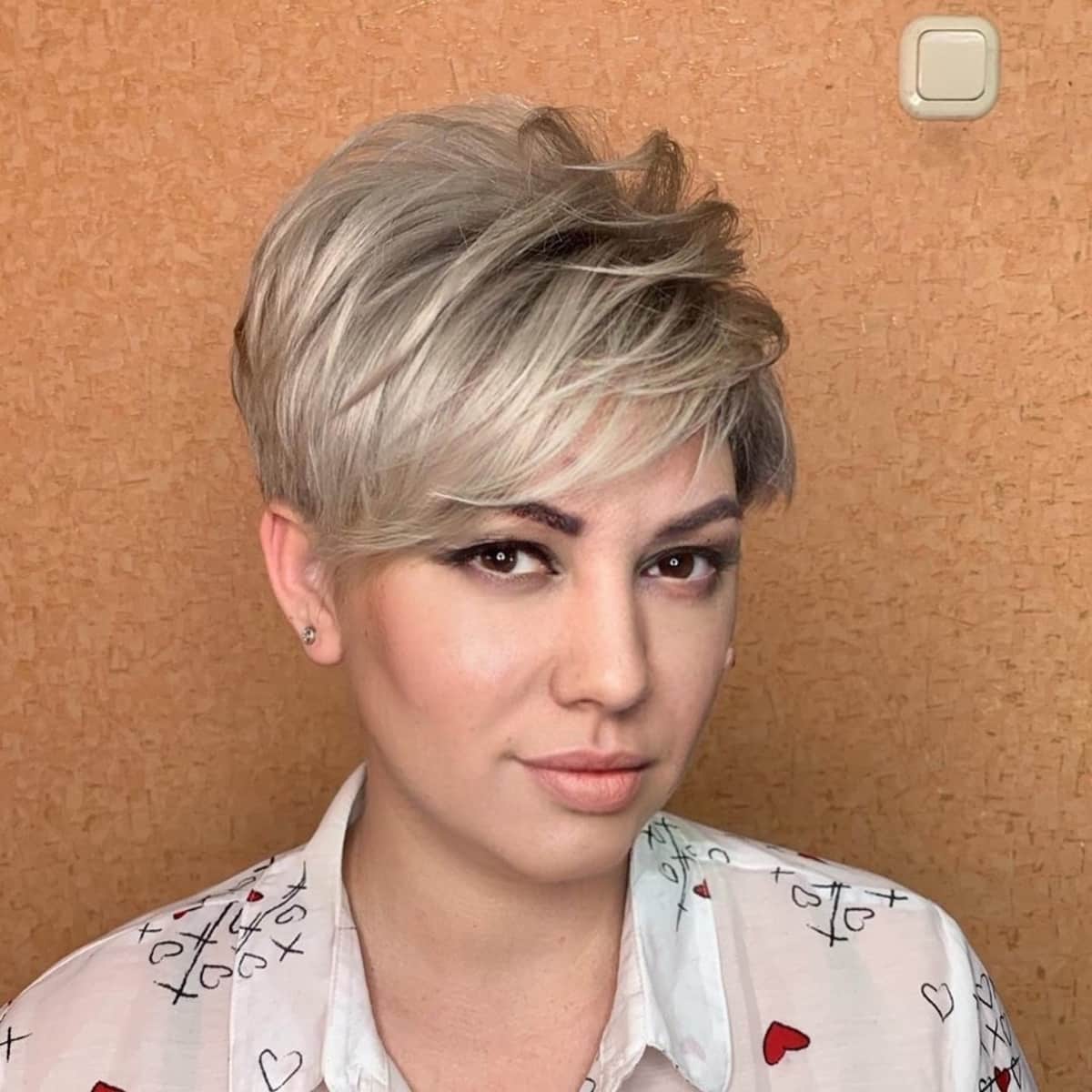 textured pixie in a tousled hairdo for oval faces