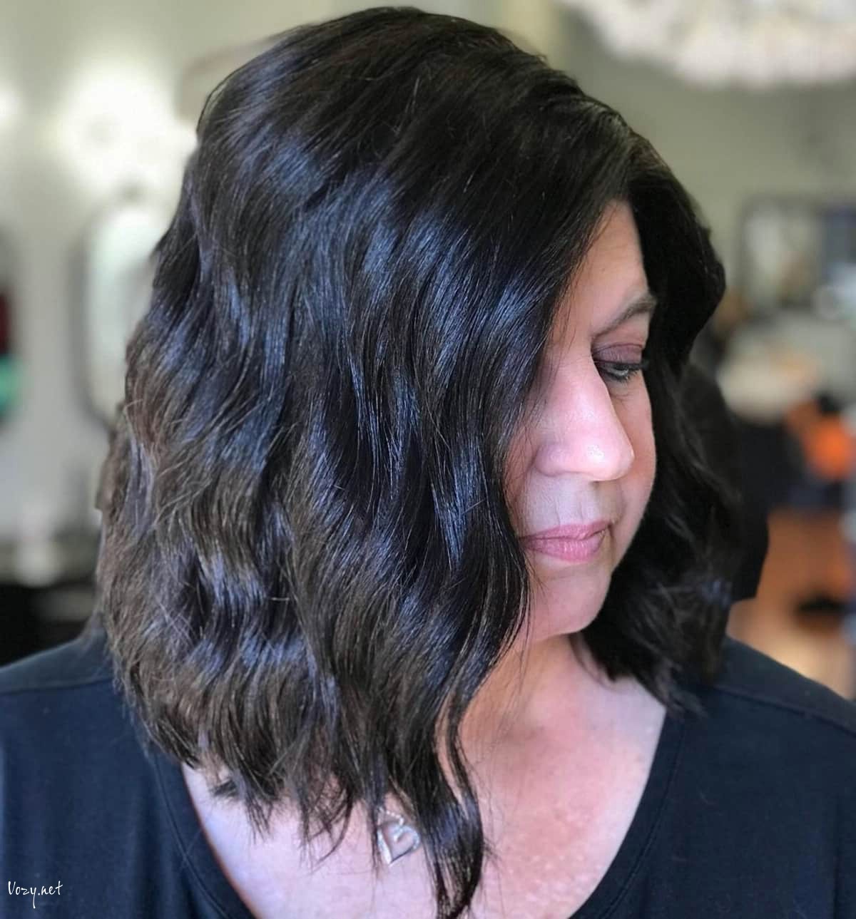 the mid stacked bob for women past their 50s with wavy hair