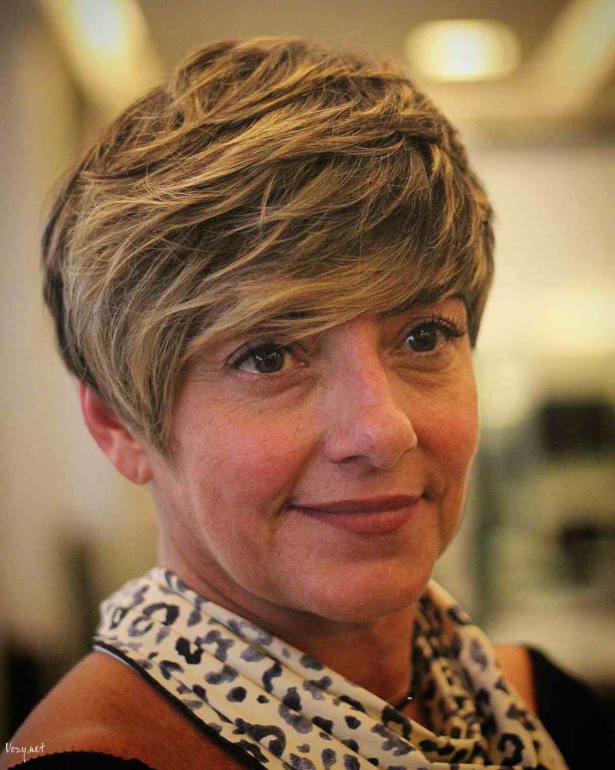thick pixie with side swept bangs for ladies 50 and over