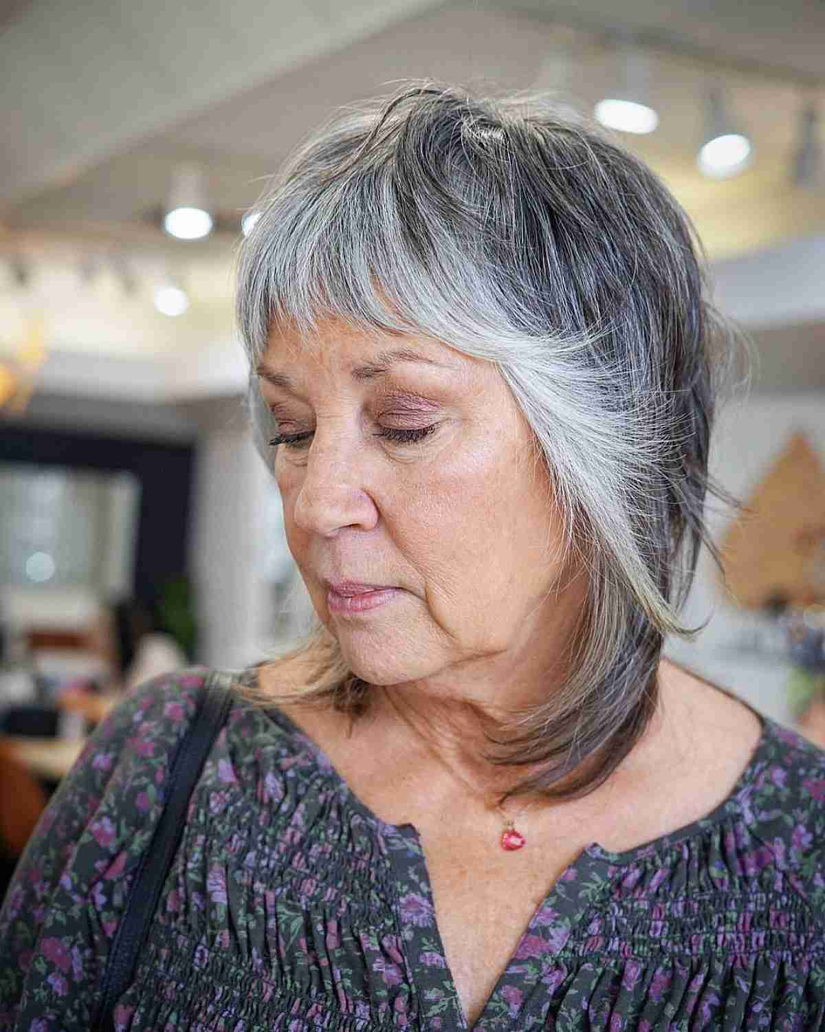 two toned razor cut on shaggy medium length hair for 70 year olds
