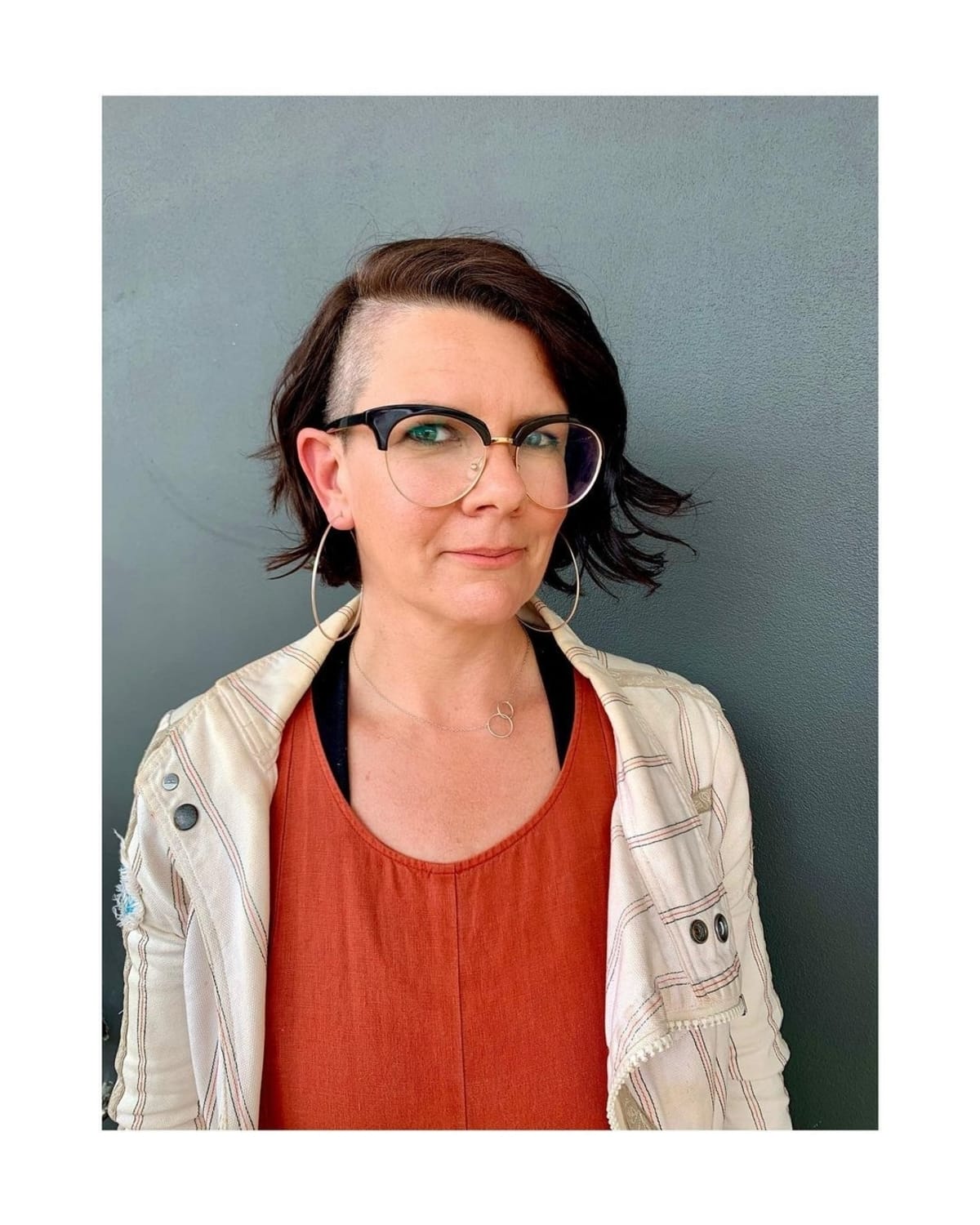 undercut pixie cut for older women who wear glasses