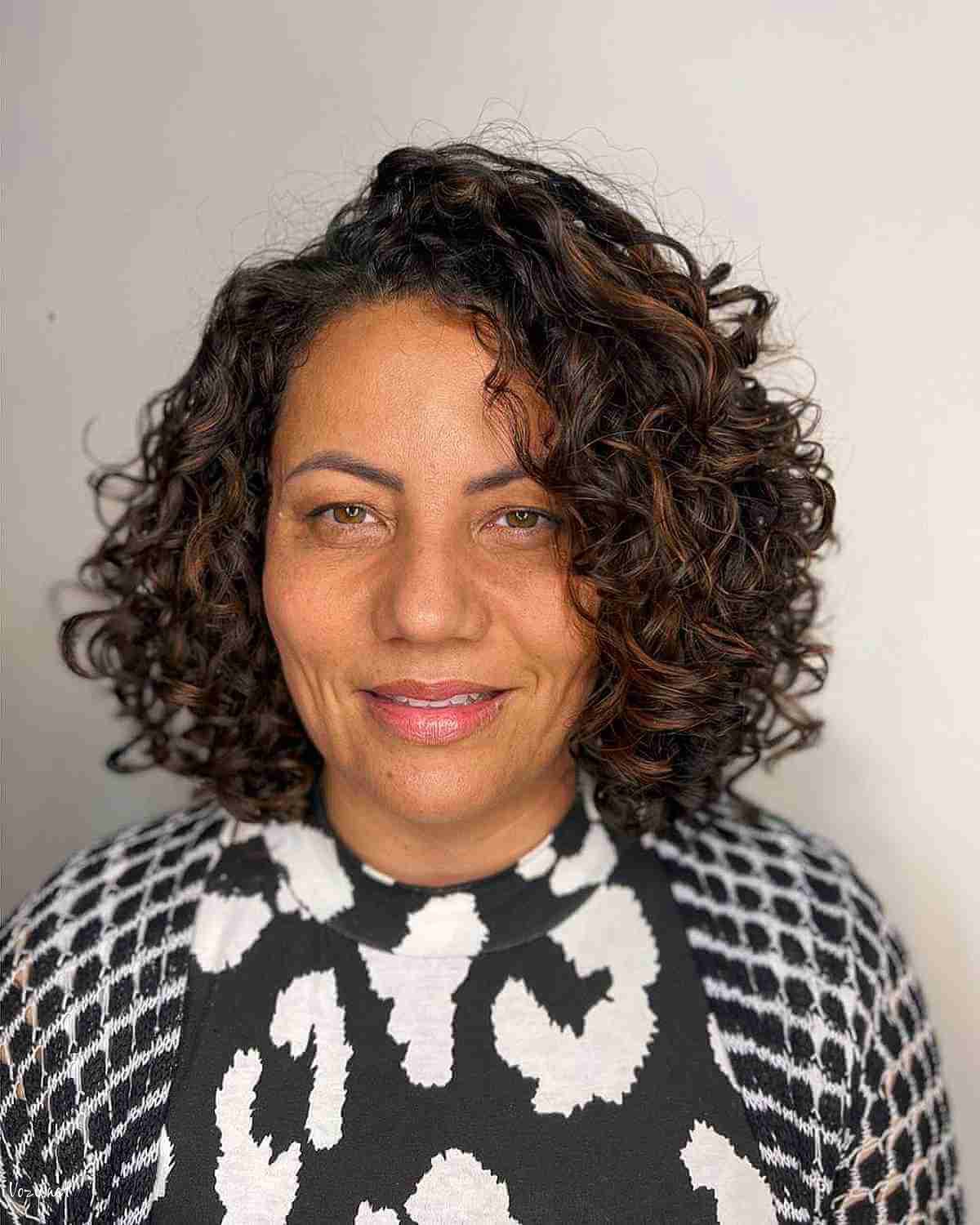 voluminous curls with a side part for ladies over fifty