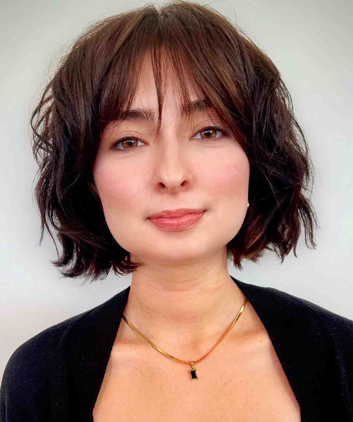 wispy long bangs on a razor cut textured bob