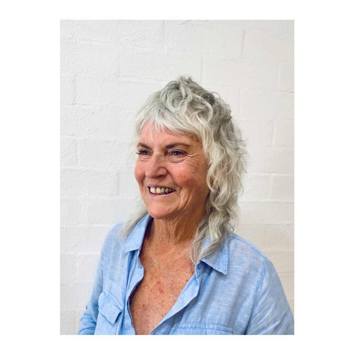 wispy shag with loose curly hair for ladies in their 70s