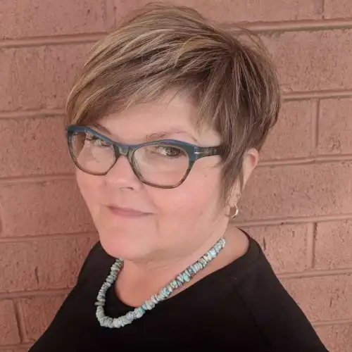 Slimming Long Pixie with a Side Swept Fringe