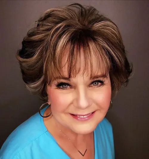 Voluminous Hairstyle with Light Straight Fringe
