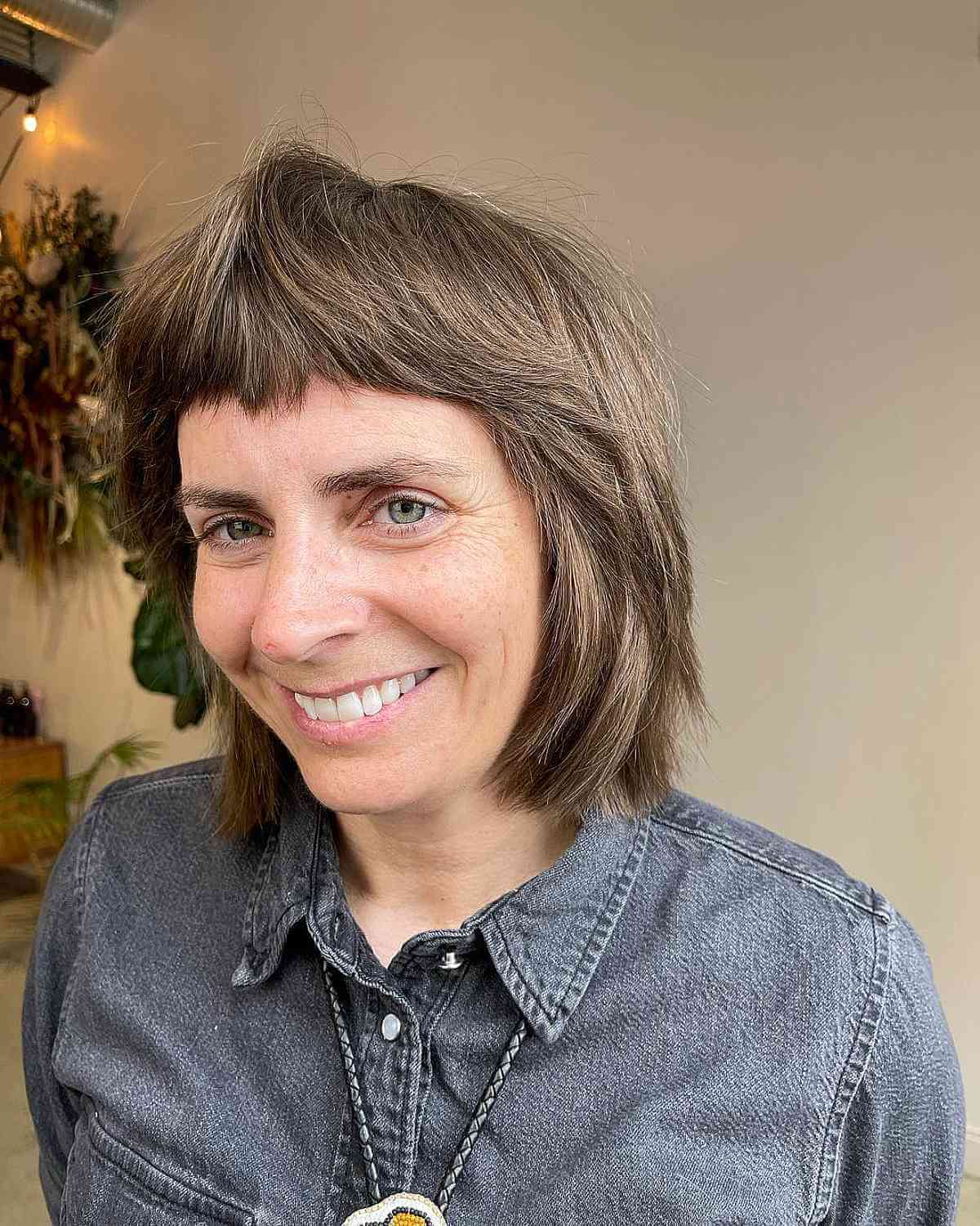 baby wolf cut with micro bangs for a 40 year old woman
