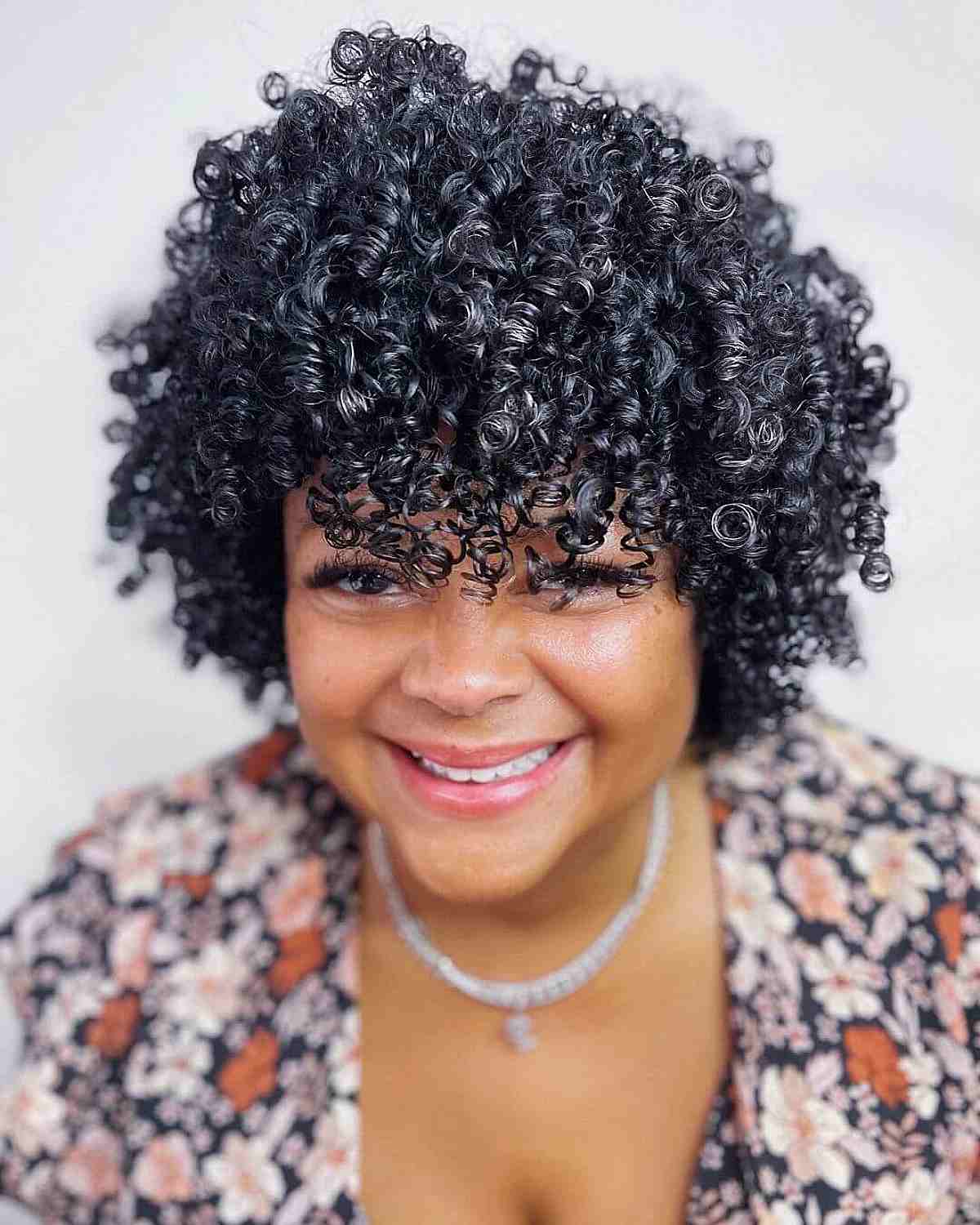 black shiny bouncy curls for black ladies 40 and over