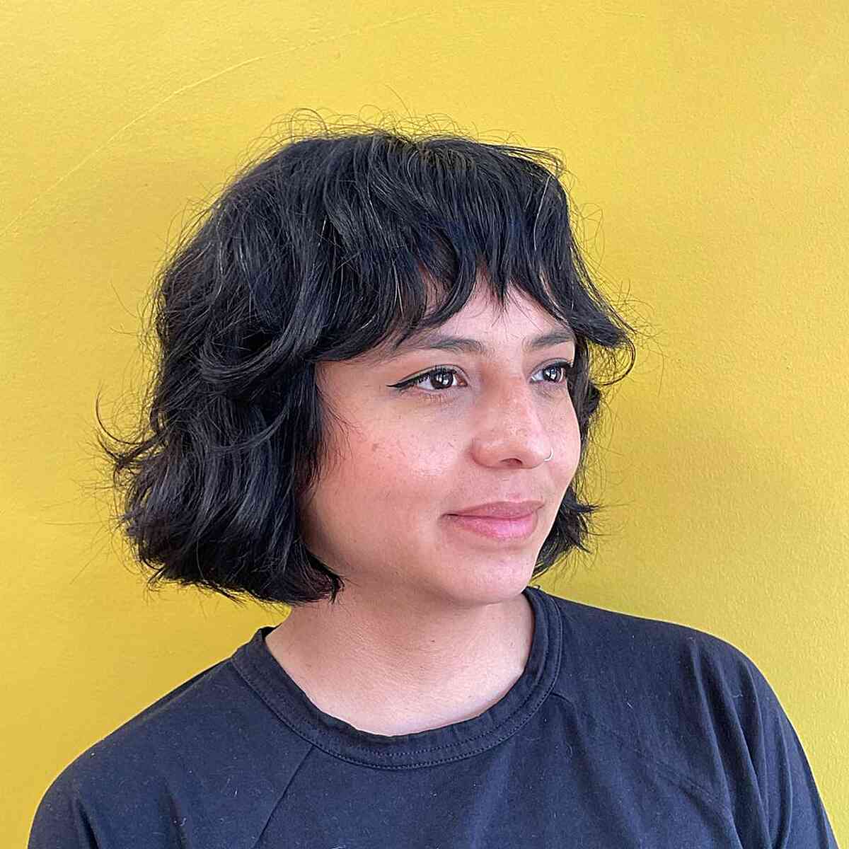 choppy bangs for short textured french bob haircut for round faces
