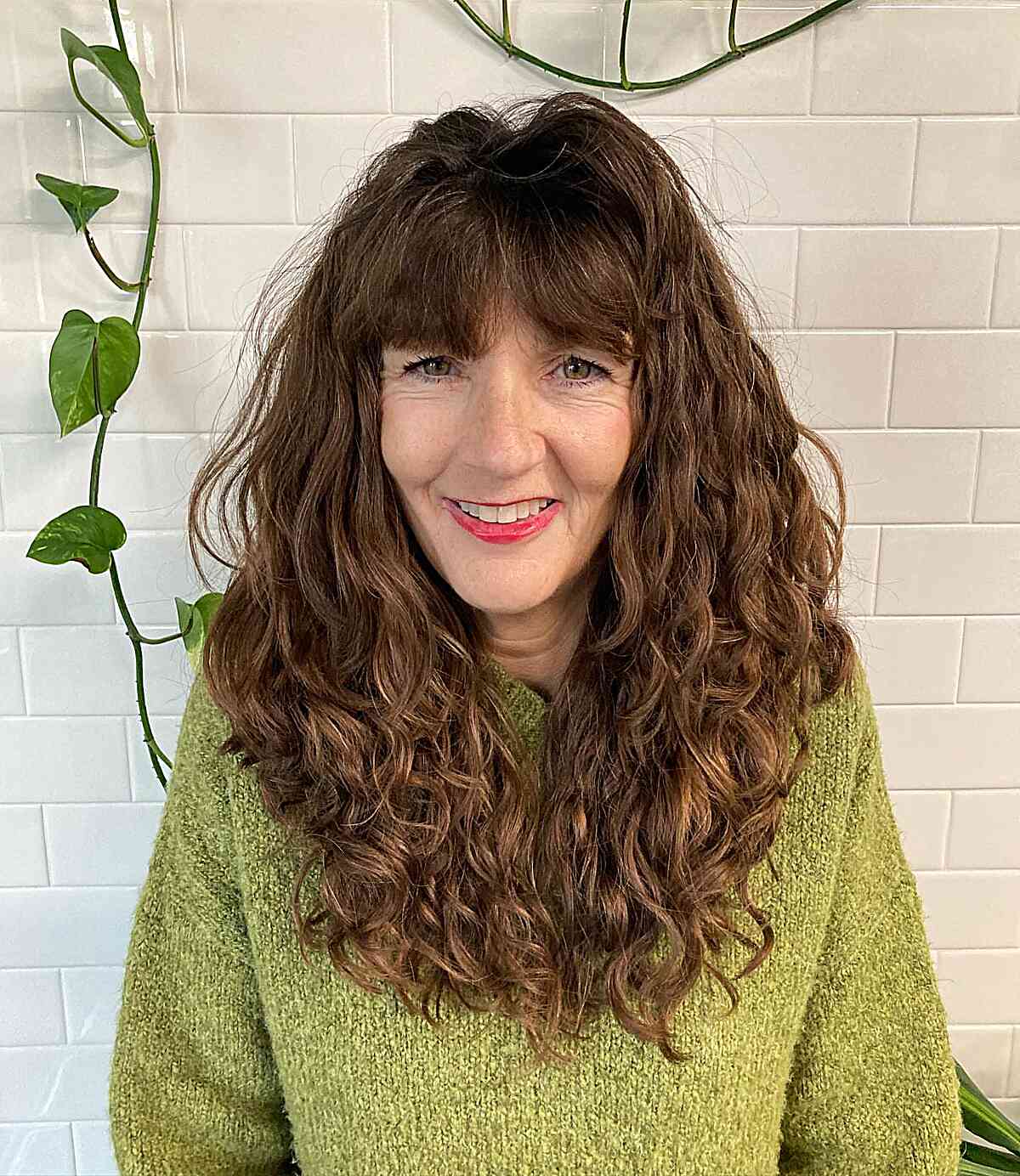 curled v cut long hair with fringe for a 60 year old